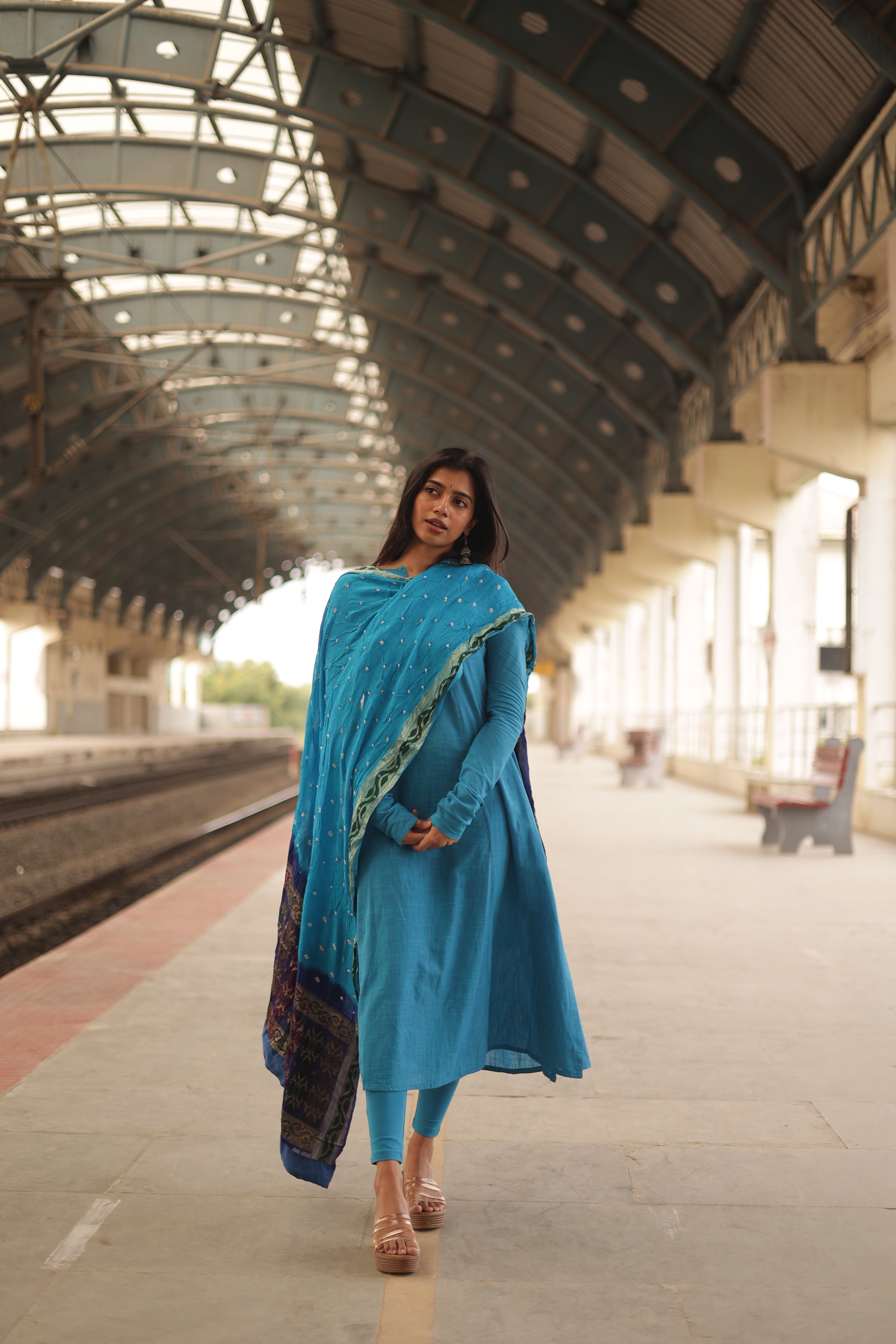 An elegant Aline kurti with side slits, The kurti has long sleeves and a simple boat neckline, add a stylish touch to the design.