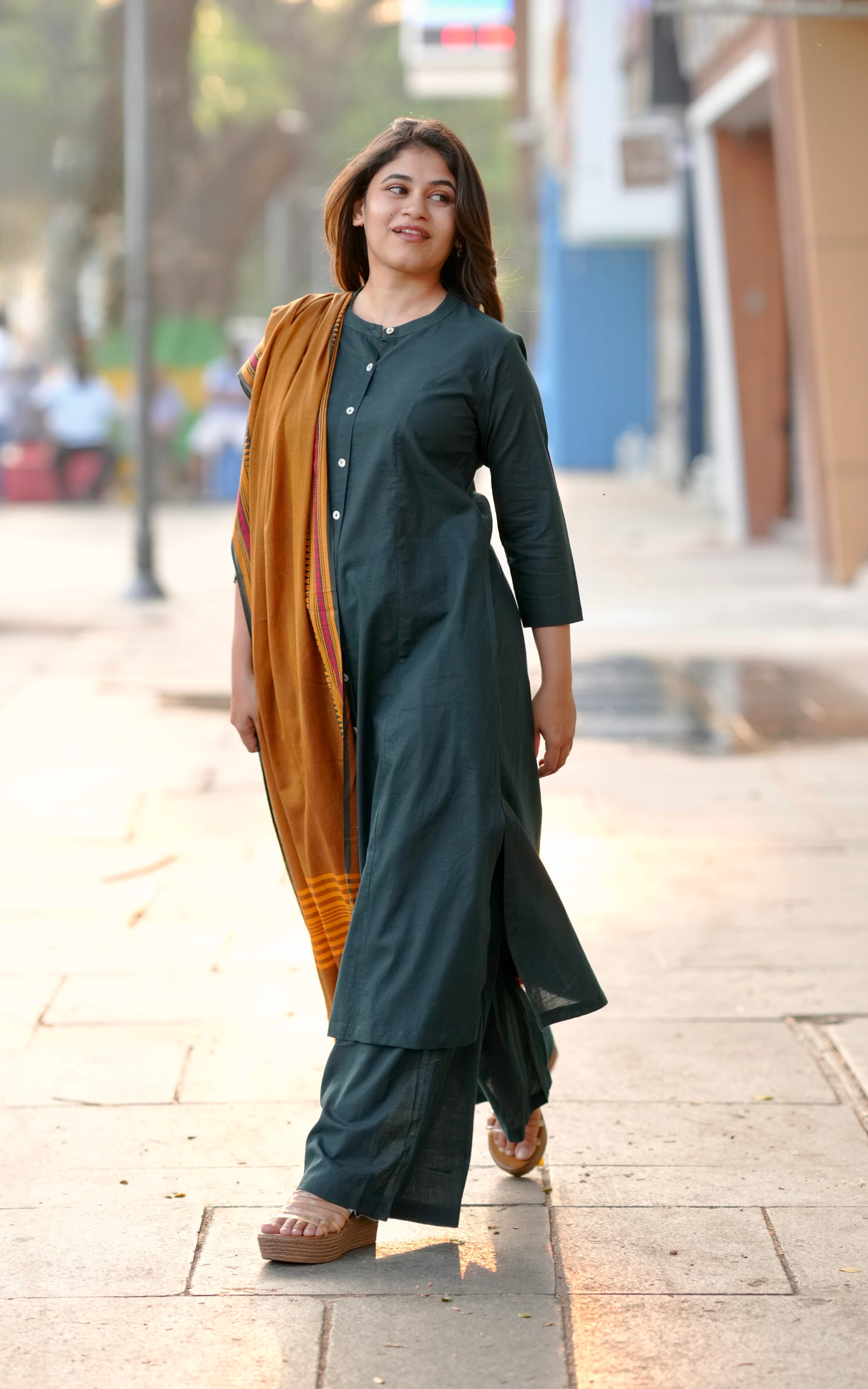 green kurti set for college girls
stylish aline kurti set
trendy cotton kurti pant set
modern front slit kurti set