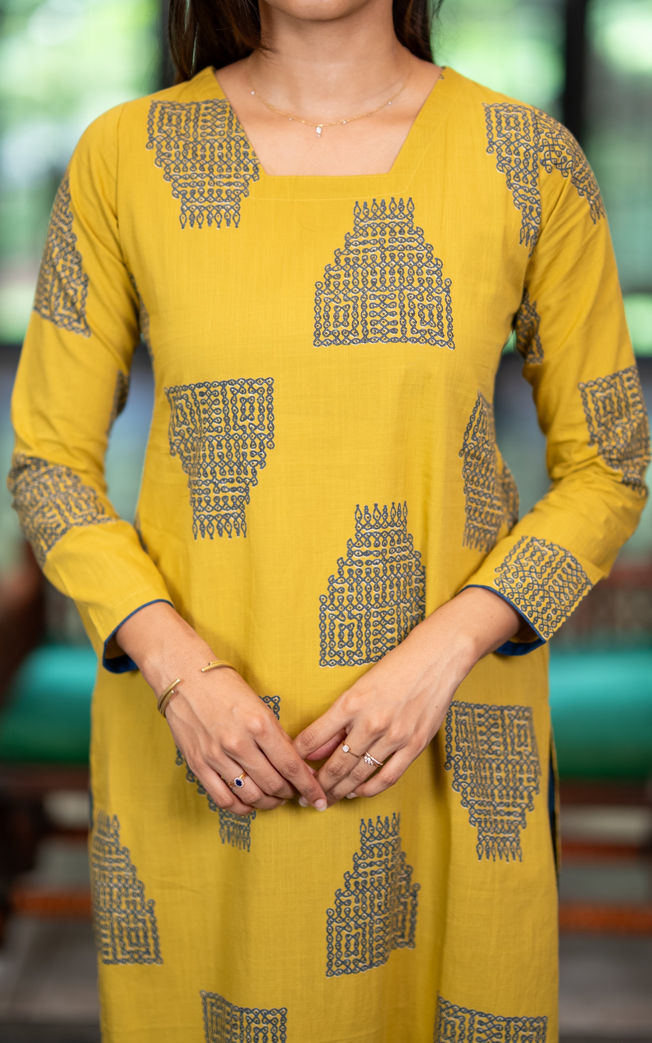 Yellow Cotton Straight Cut Kurti with Looped Rangoli Line Print for Women