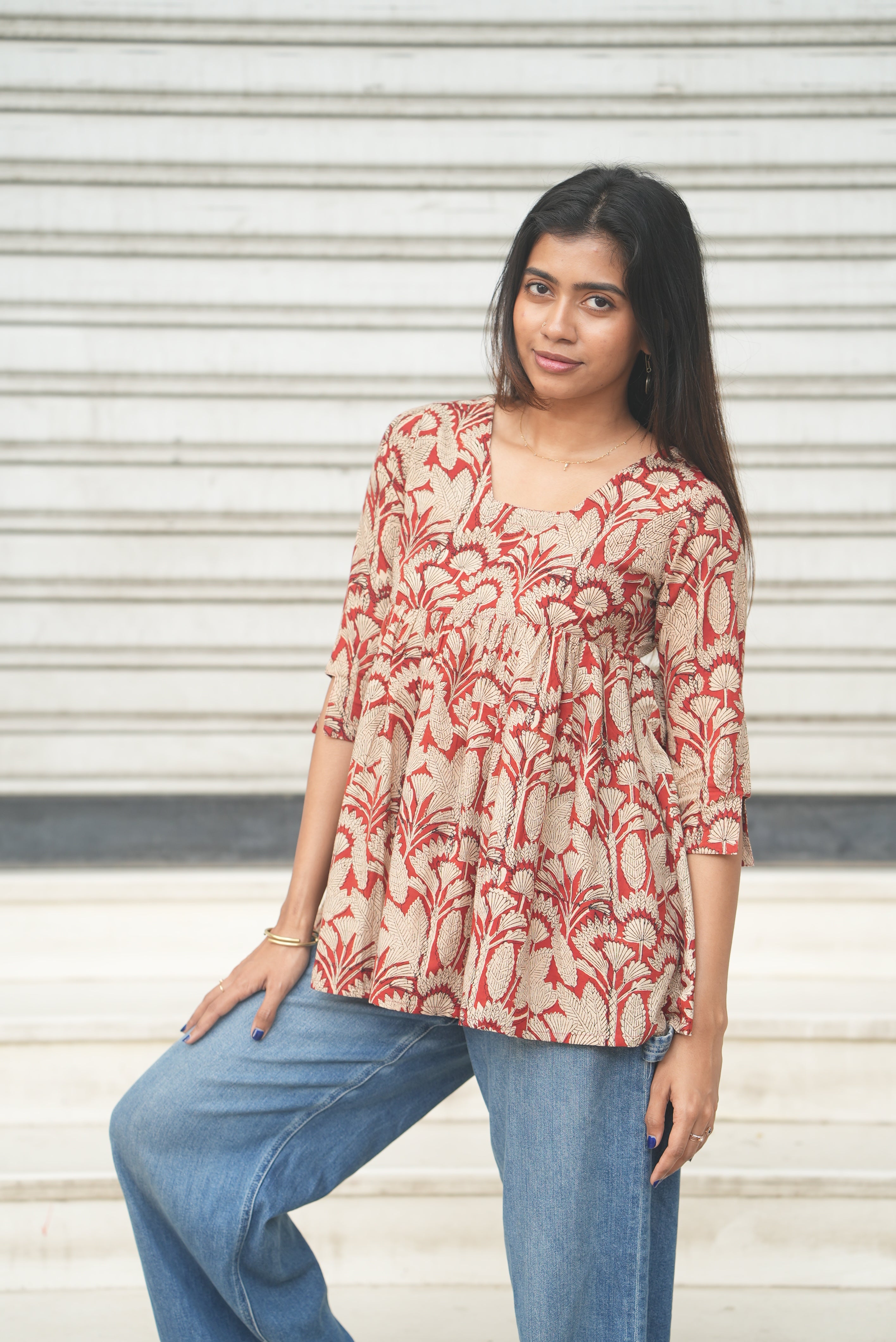 Rust hand block printed cotton flared A-line short kurti.