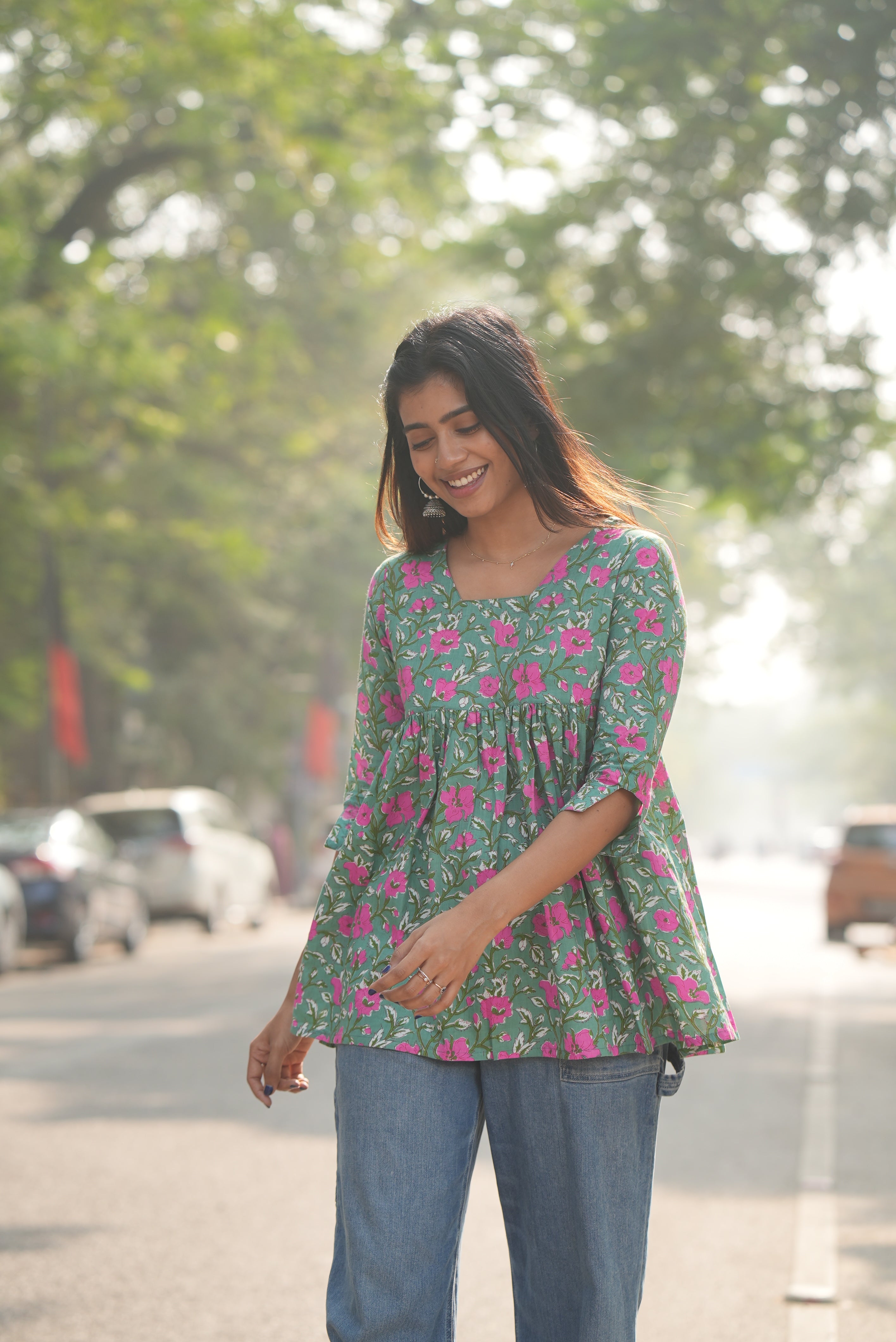 Green A-line cotton short kurti with traditional block print.