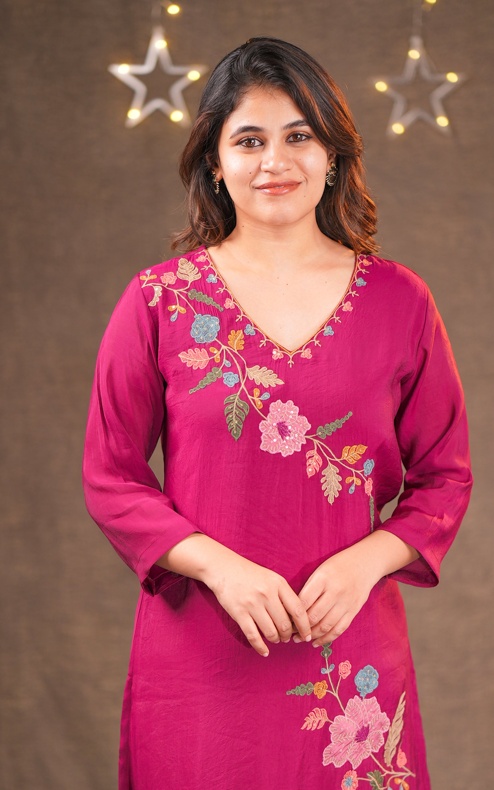 Woman wearing a maroon embroidered kurti