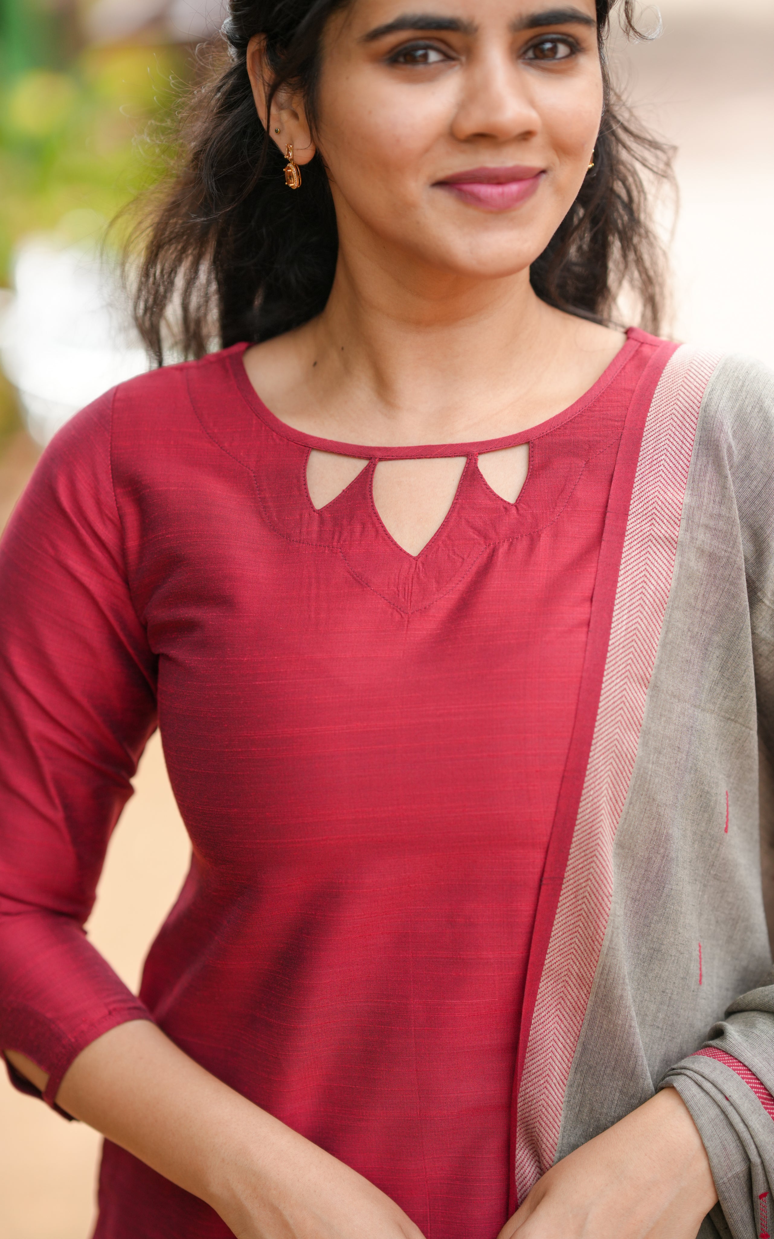 Neckline features a modest round shape