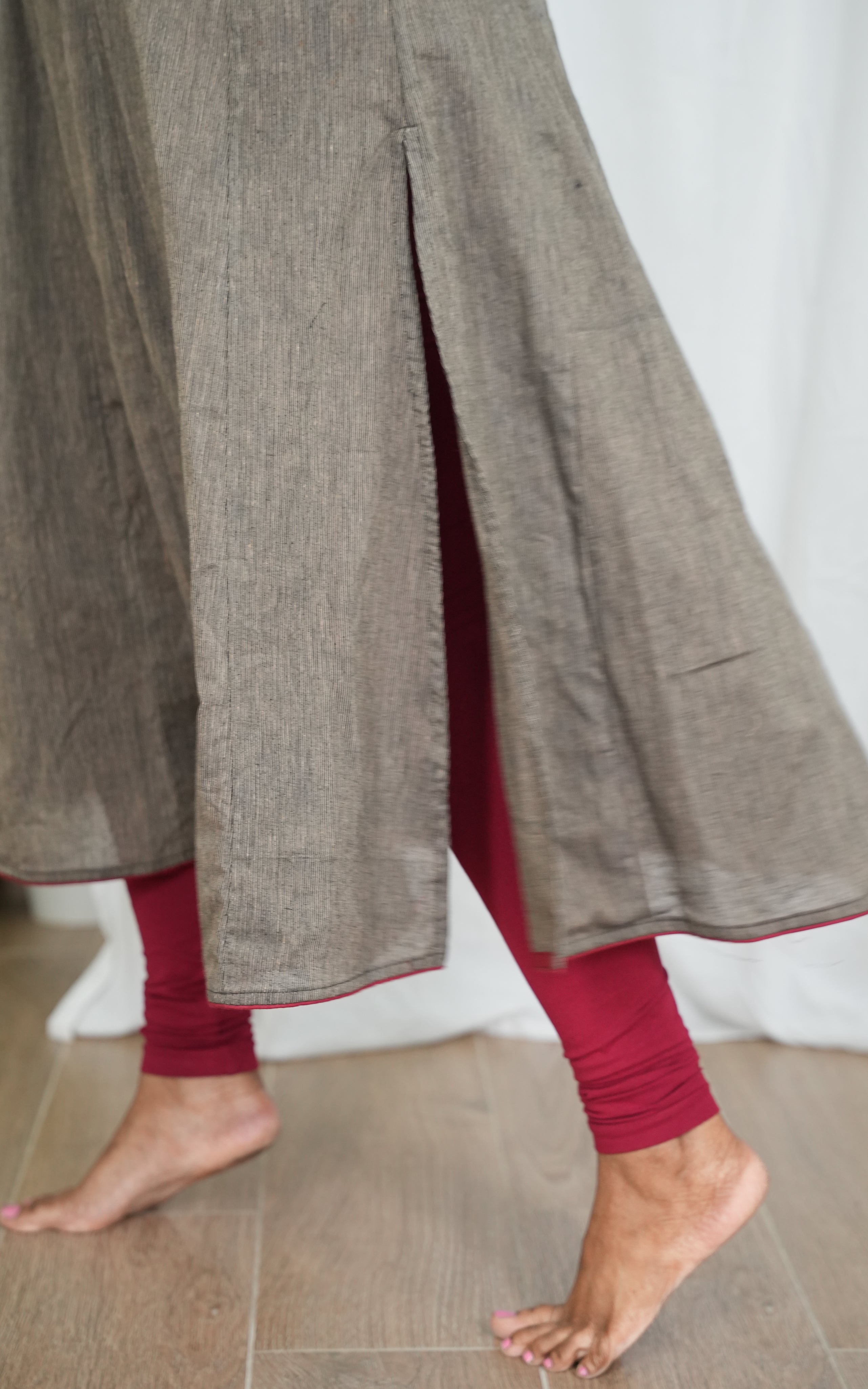 Sophisticated black South Cotton kurti with side slit, matched with a grey dupatta trimmed in maroon borders for a chic, timeless look