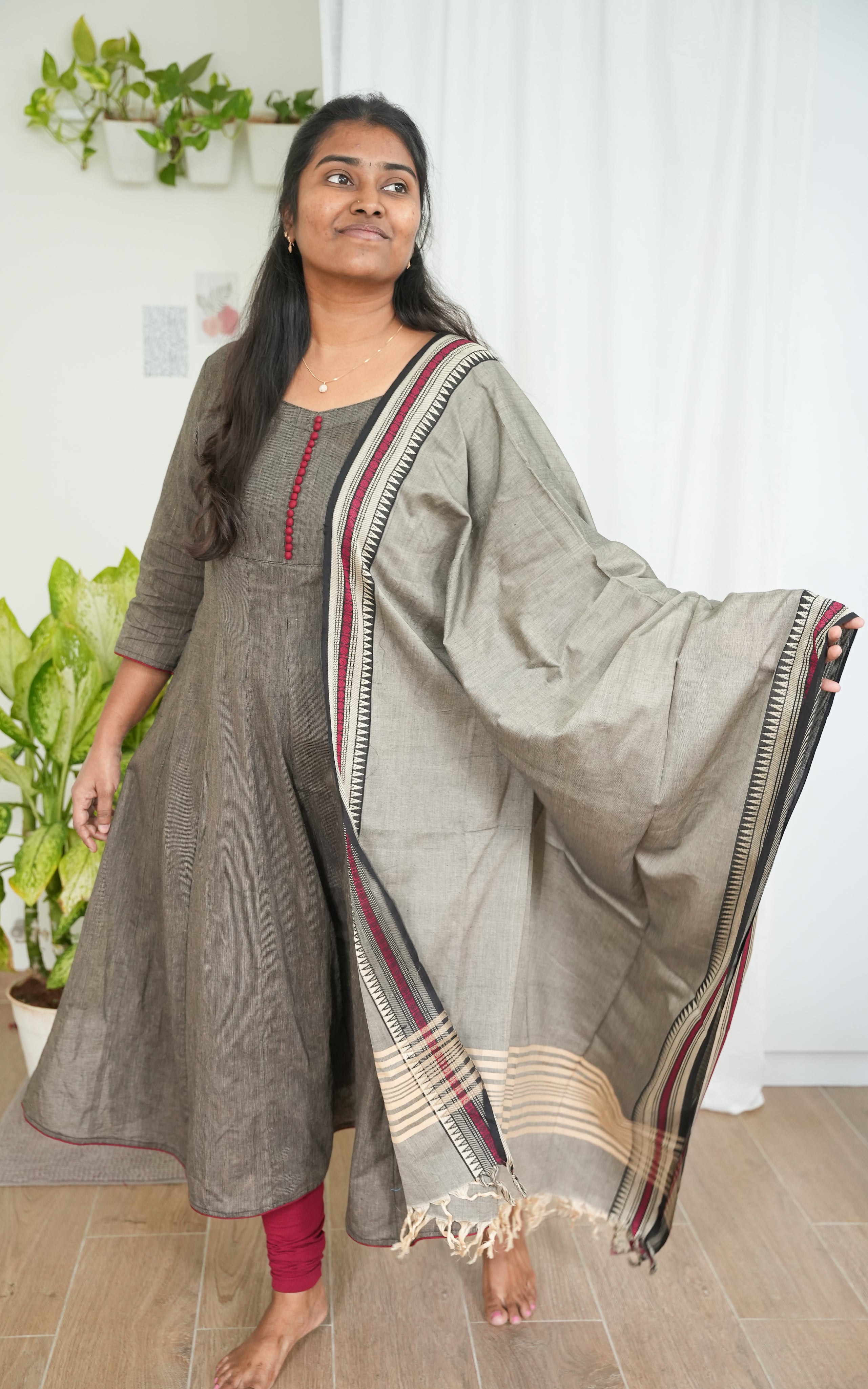 Black A-line kurti made from breathable South Cotton, paired with a grey dupatta featuring bold maroon borders for an eye-catching contrast