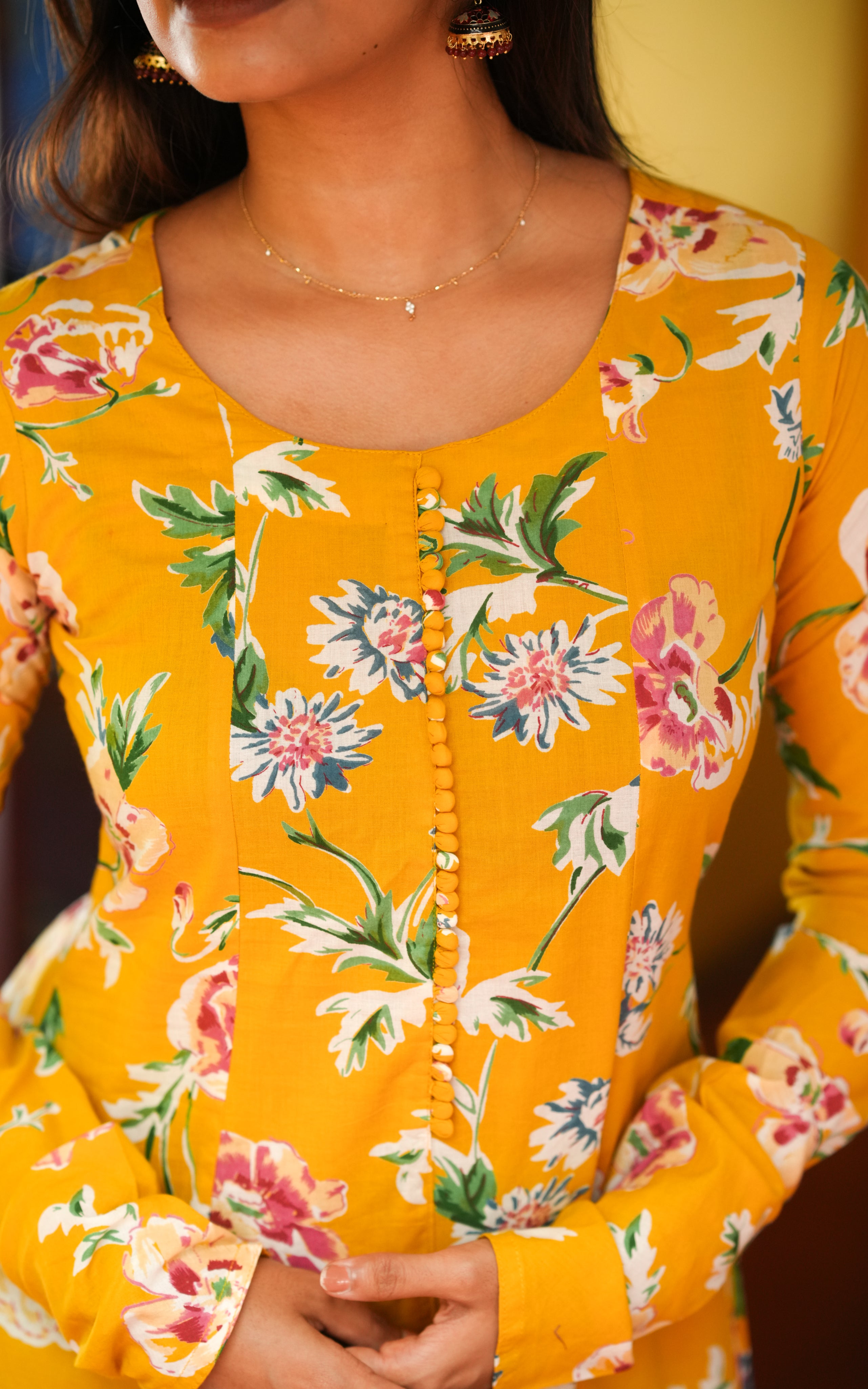 The kurti features a colorful floral print all over.