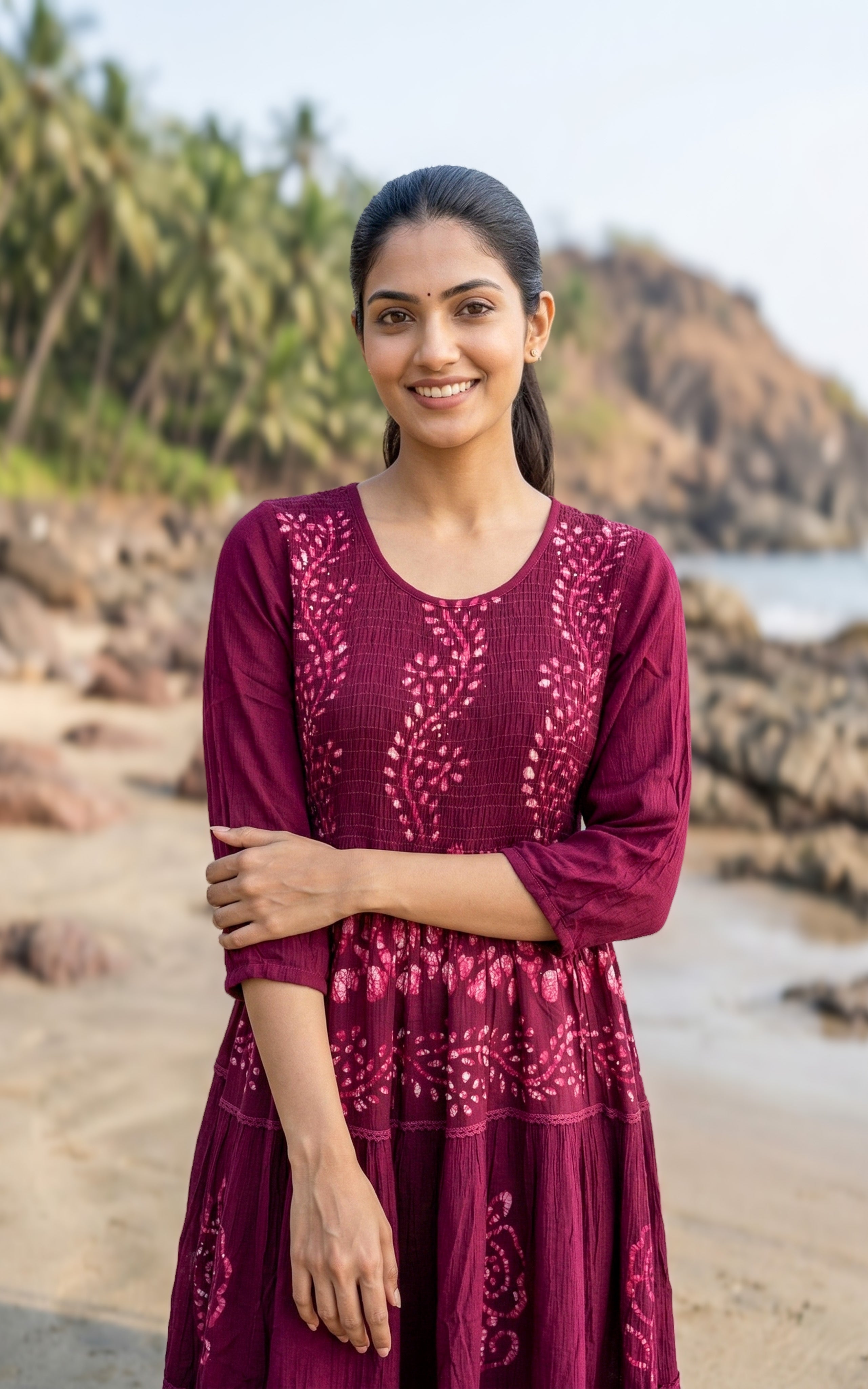 Maroon smocked Indo Western maxi dress made from viscose fabric.