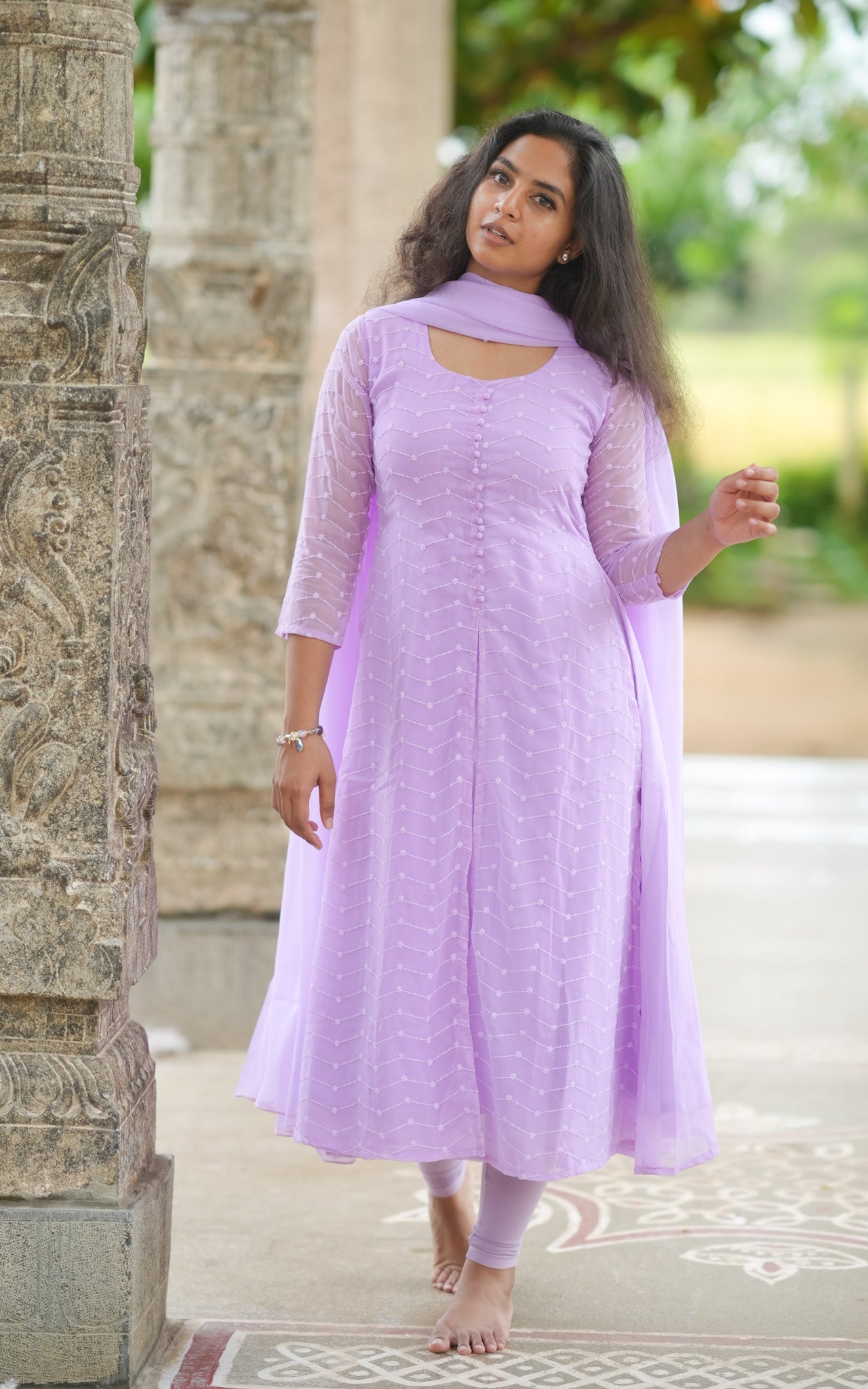 Recreate Jyothika's iconic temple scene look from Kushi movie with this elegant lavender Anarkali suit.