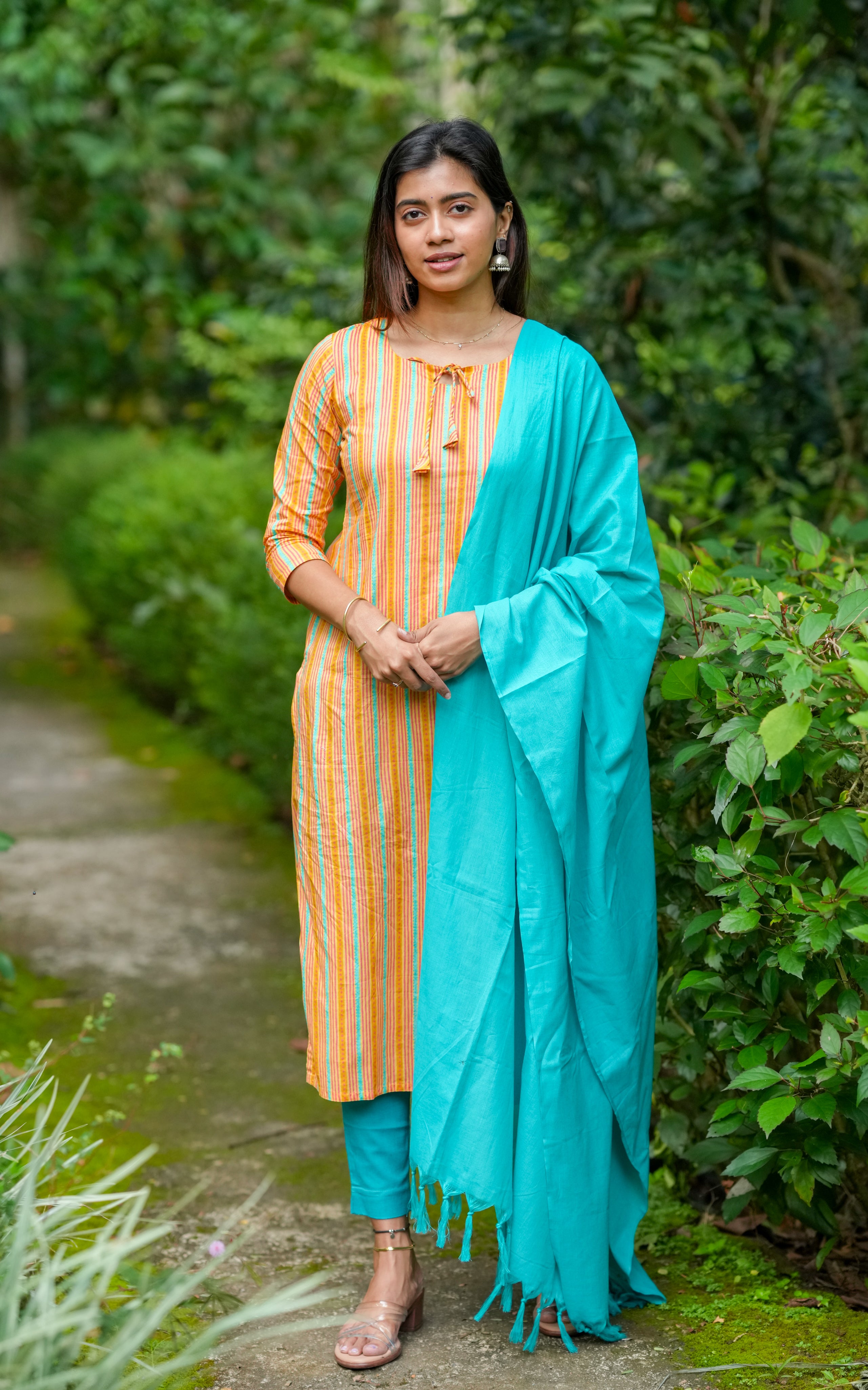 Classic straight-cut kurti paired with a light dupatta for daily grace.