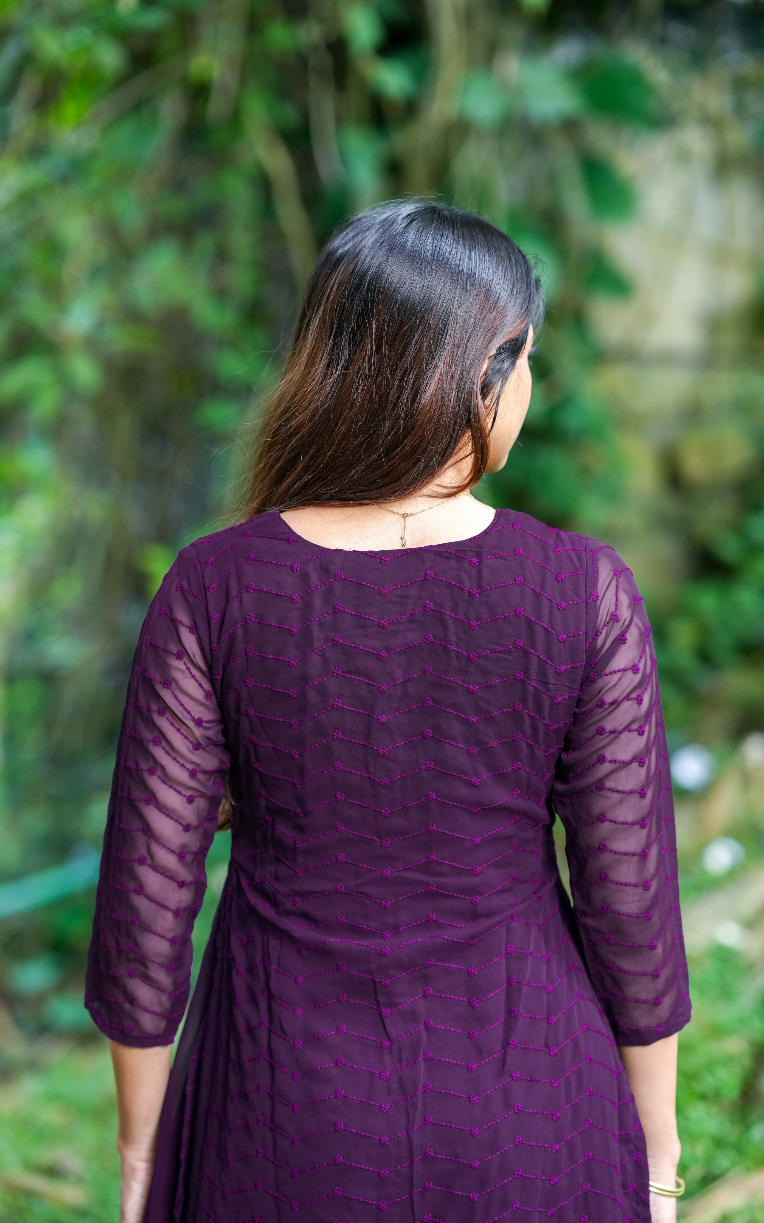 Back neckline features a modest round shape