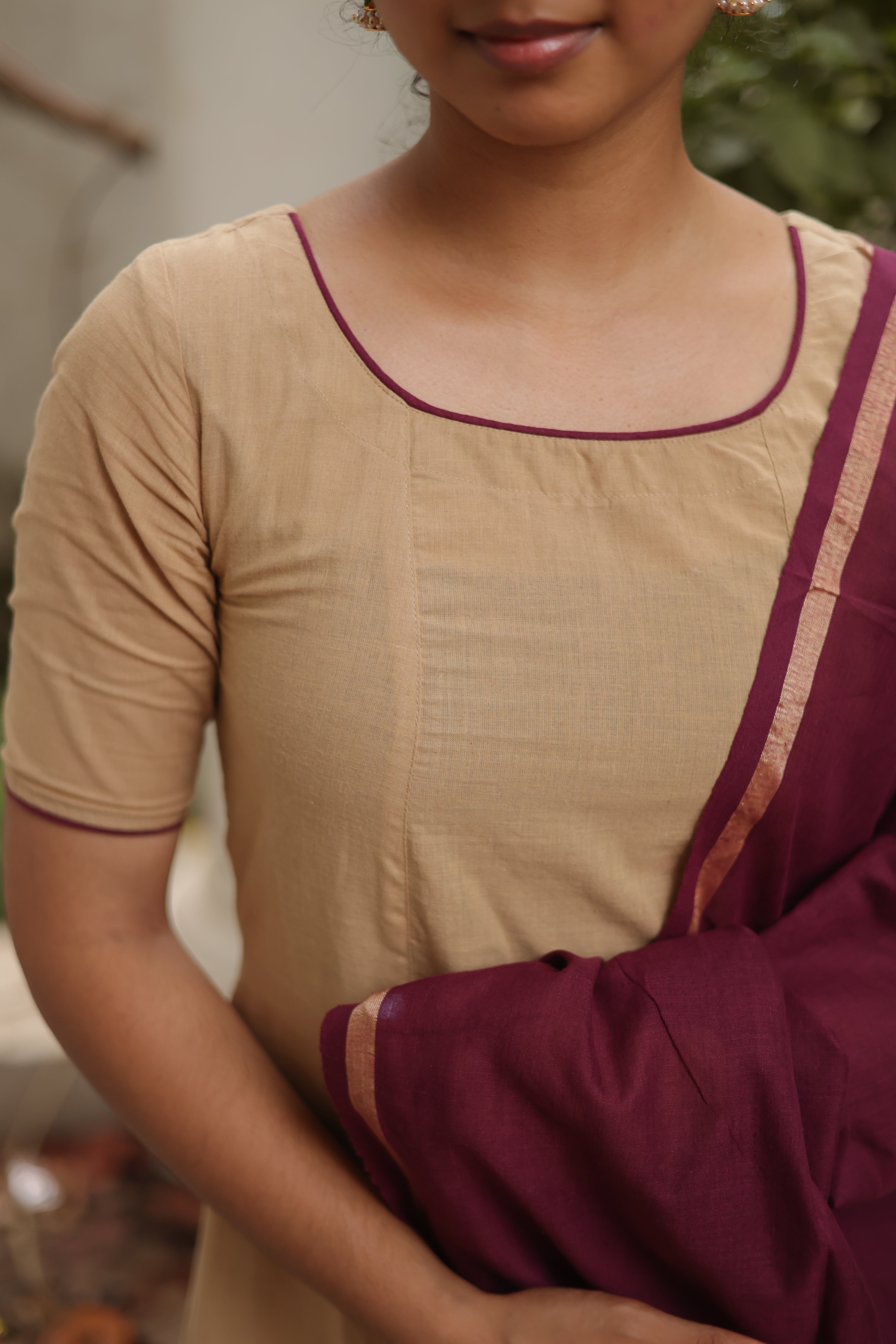 color combination of sandal and brown offers a warm, earthy vibe, making it both elegant and versatile,3/4th sleeves add a balanced touch,outfit includes a handloom cotton dupatta,enhanced with back knots, adding a modern, trendy look