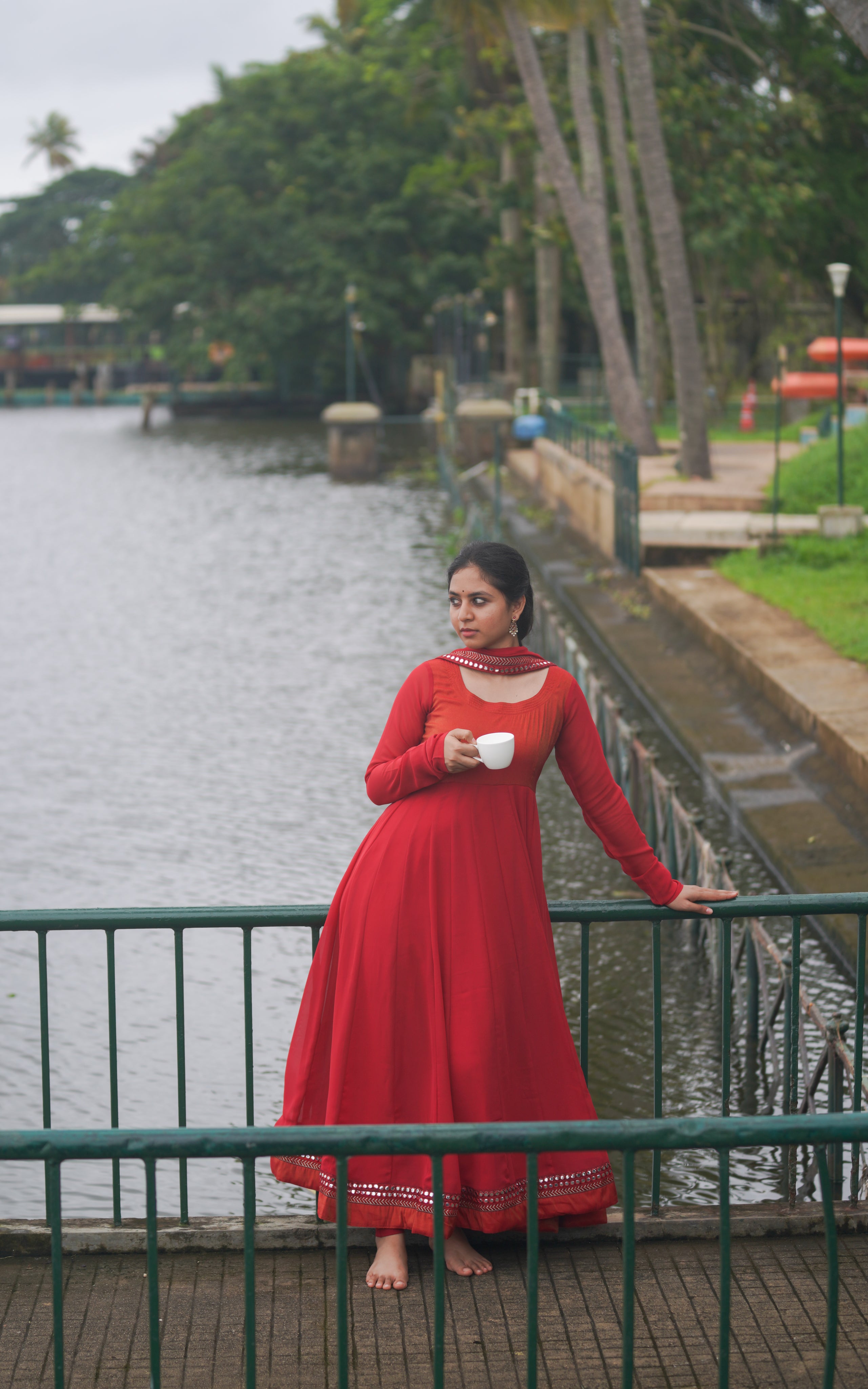 red traditional dress with full sleeves, mirror border, Raavanan movie look
