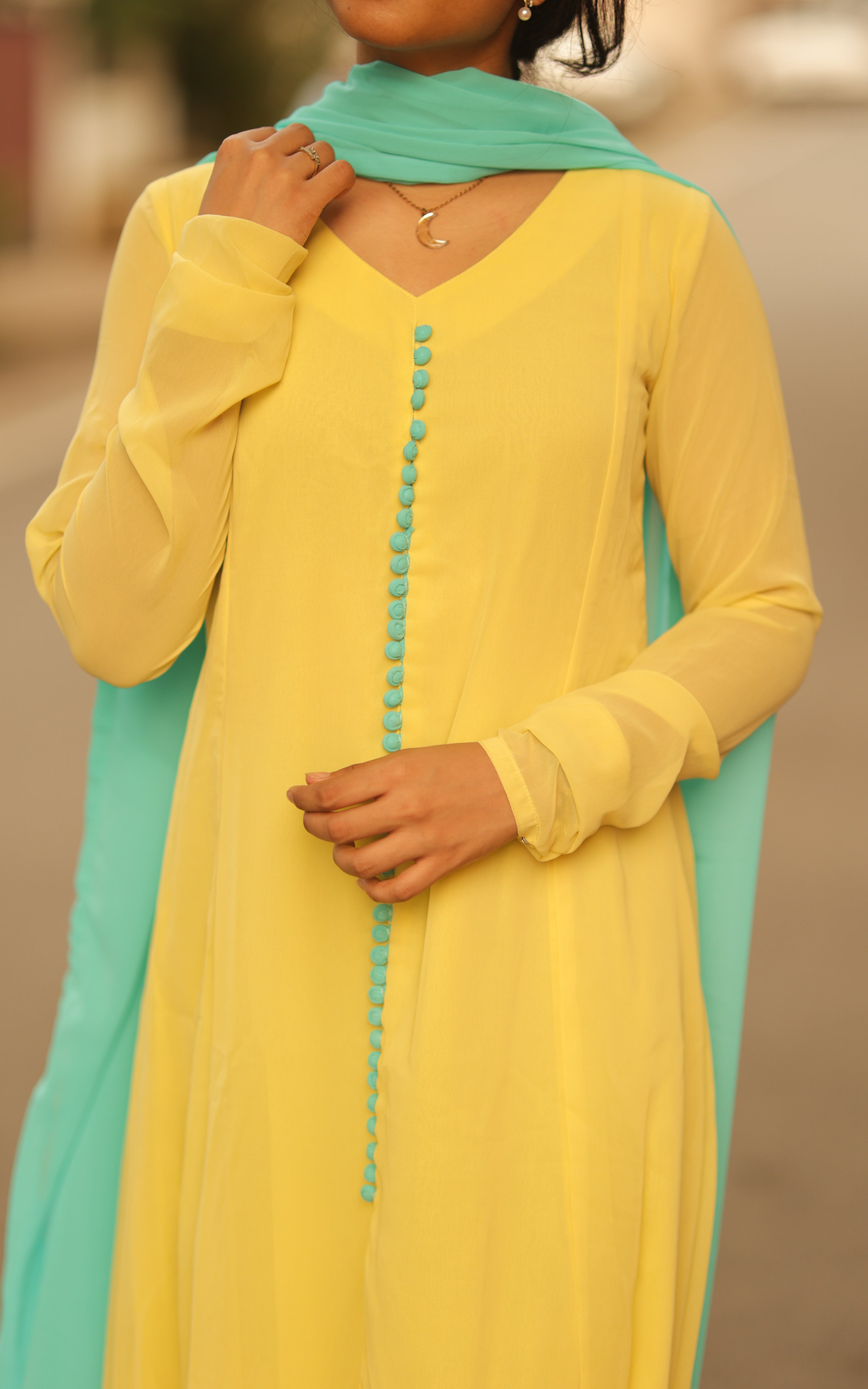 Georgette anarkali with Cotton Lining and Georgette dupatta,A fashionable yellow-colored outfit by kannedhirey thondrinal simran, featuring a sleek and trendy design.