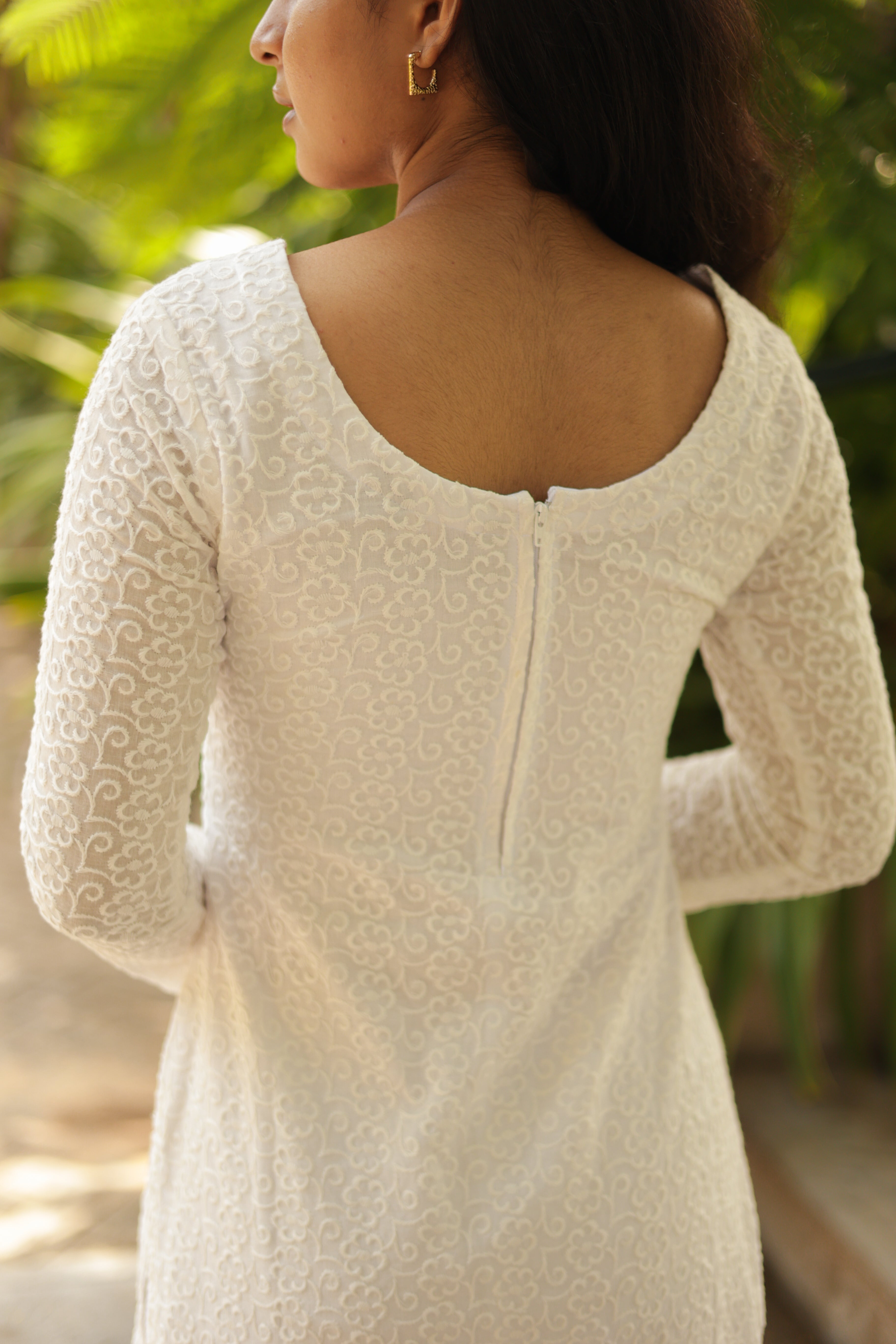 Simple back lets the dupatta and front embroidery stand out.