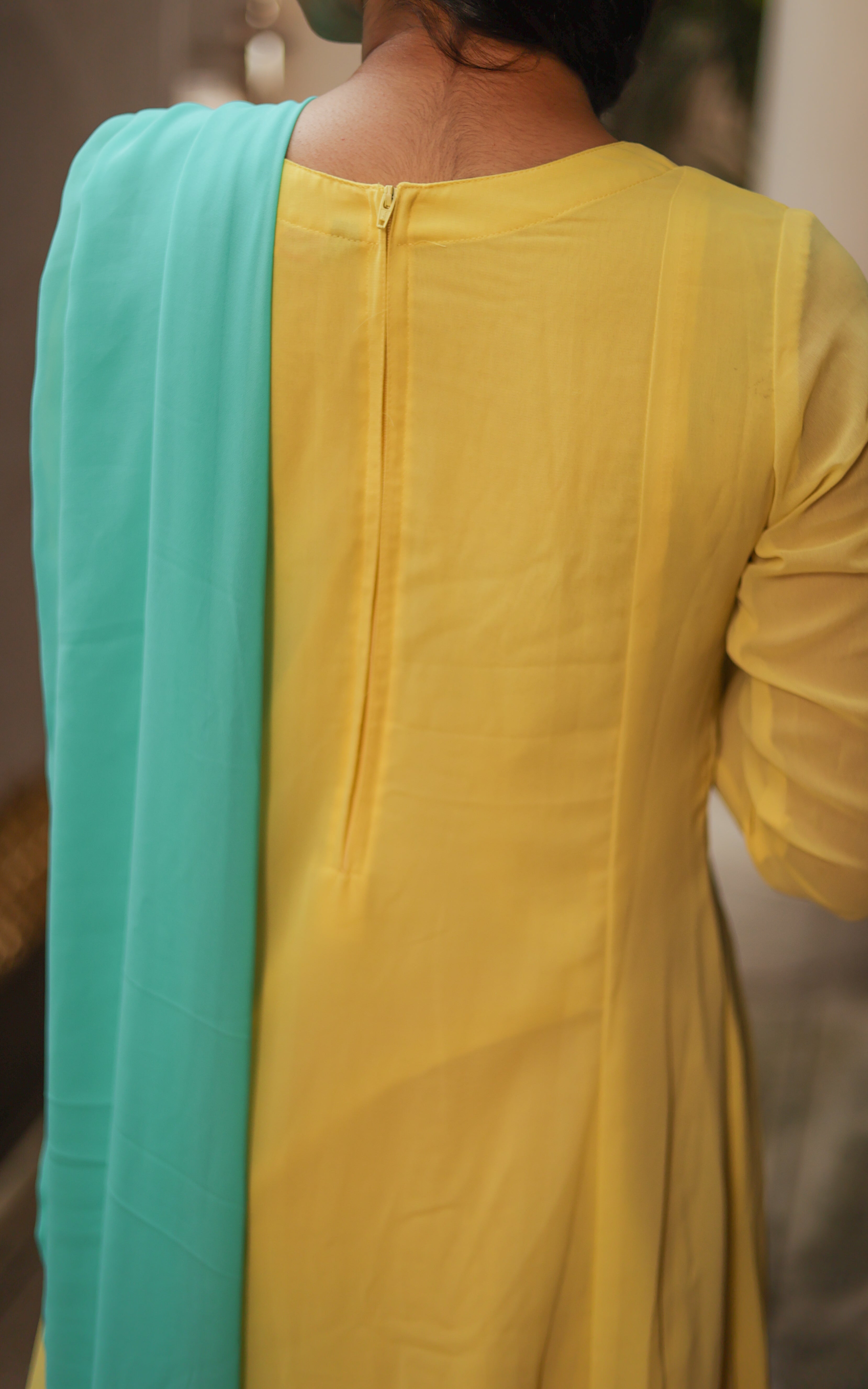 Elegant kurti featuring a back zipper closure, designed for a perfect fit. The zip ensures a sleek and tailored look, ideal for a stylish and comfortable appearance. kurti pair with aqua leggings