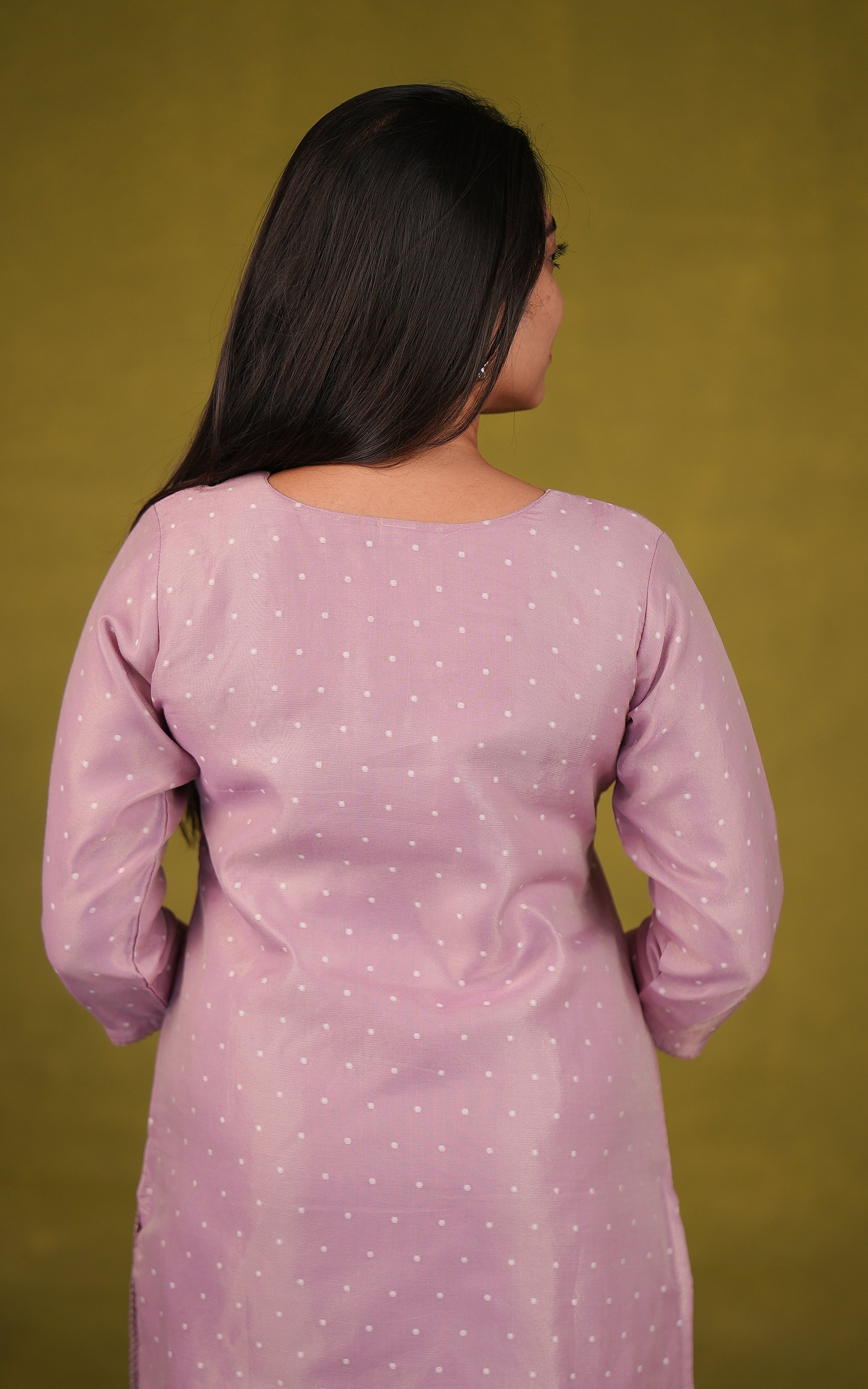 Back neckline features a modest round shape