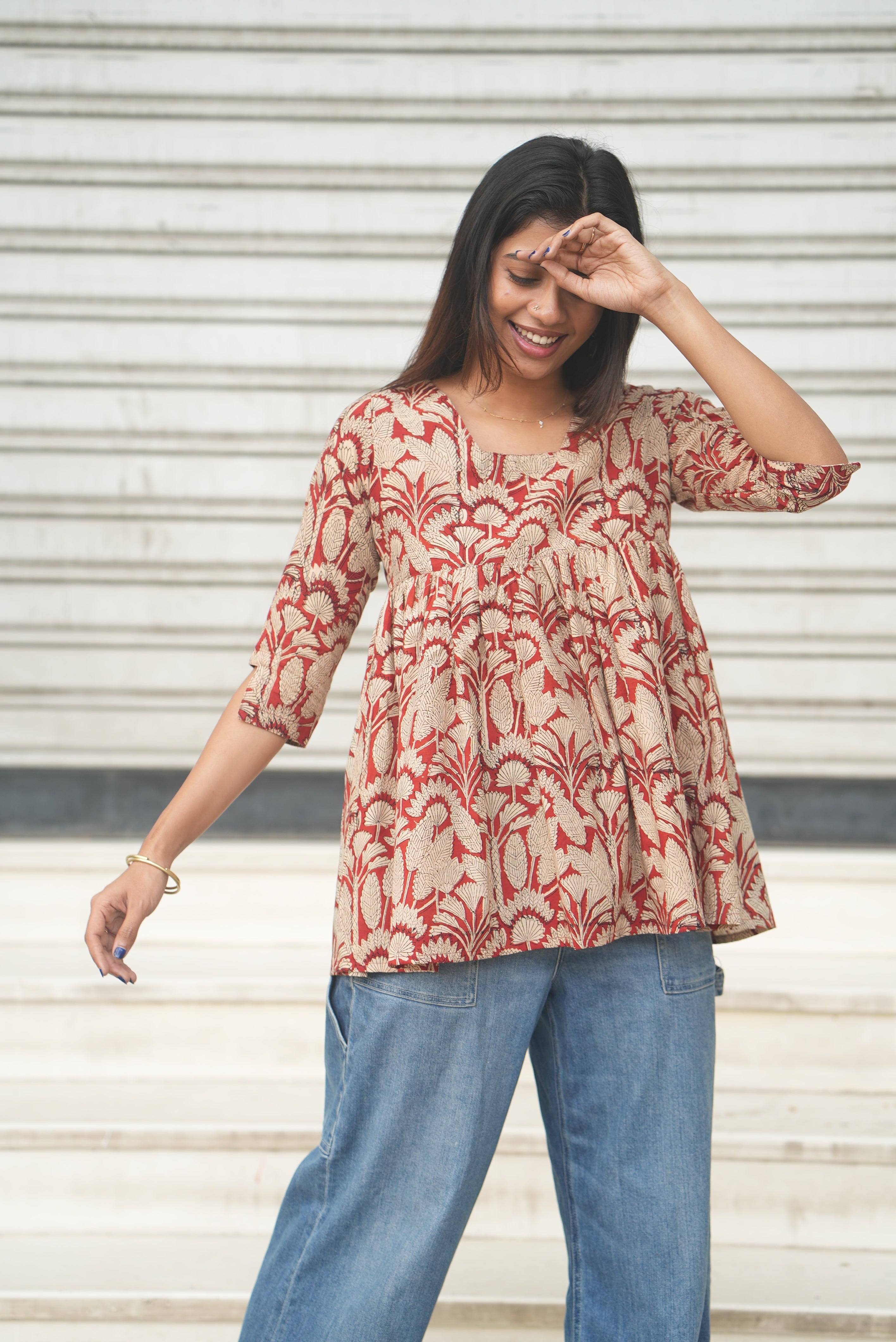 Rust block printed cotton A-line short top.