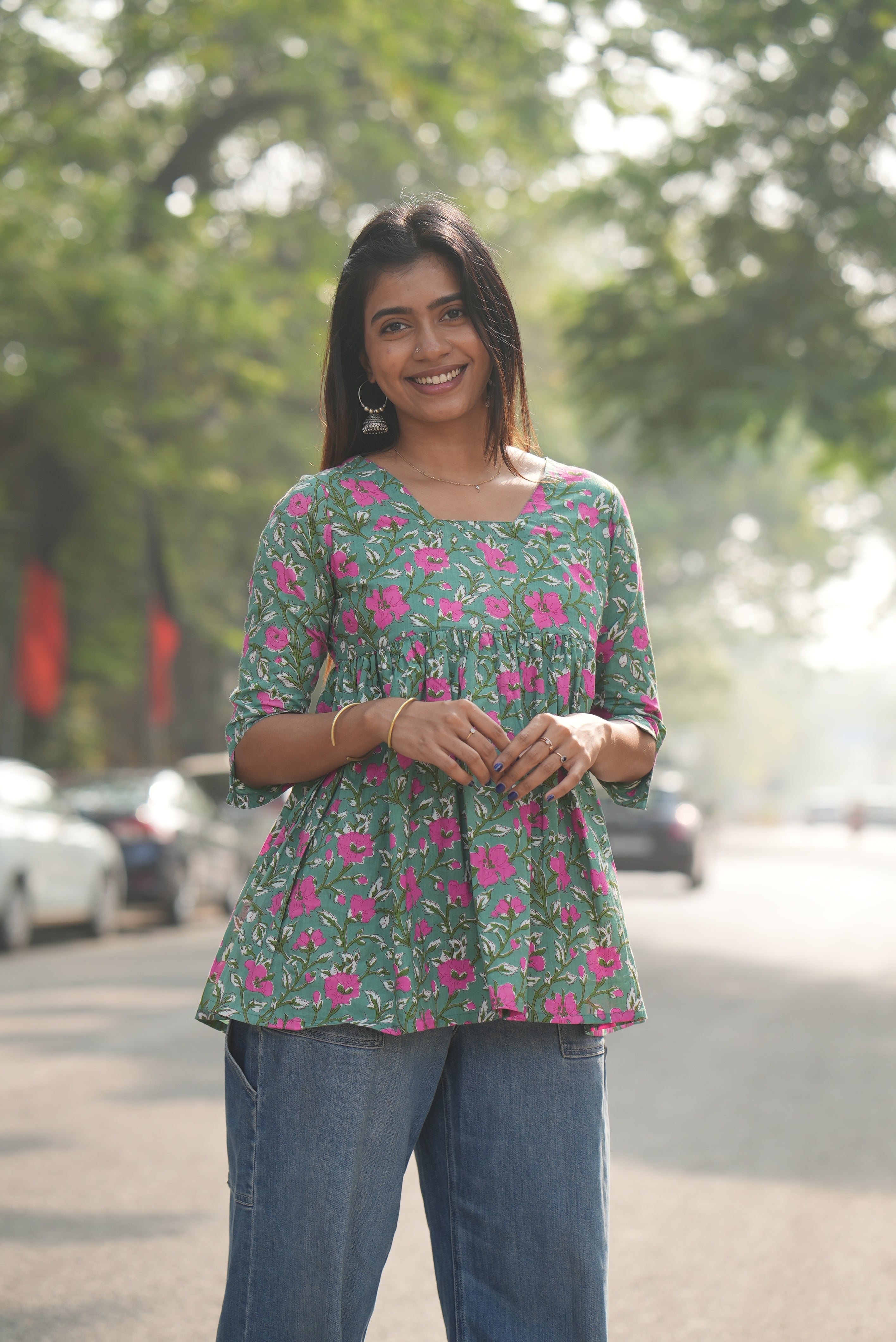 Green block printed cotton A-line short top.