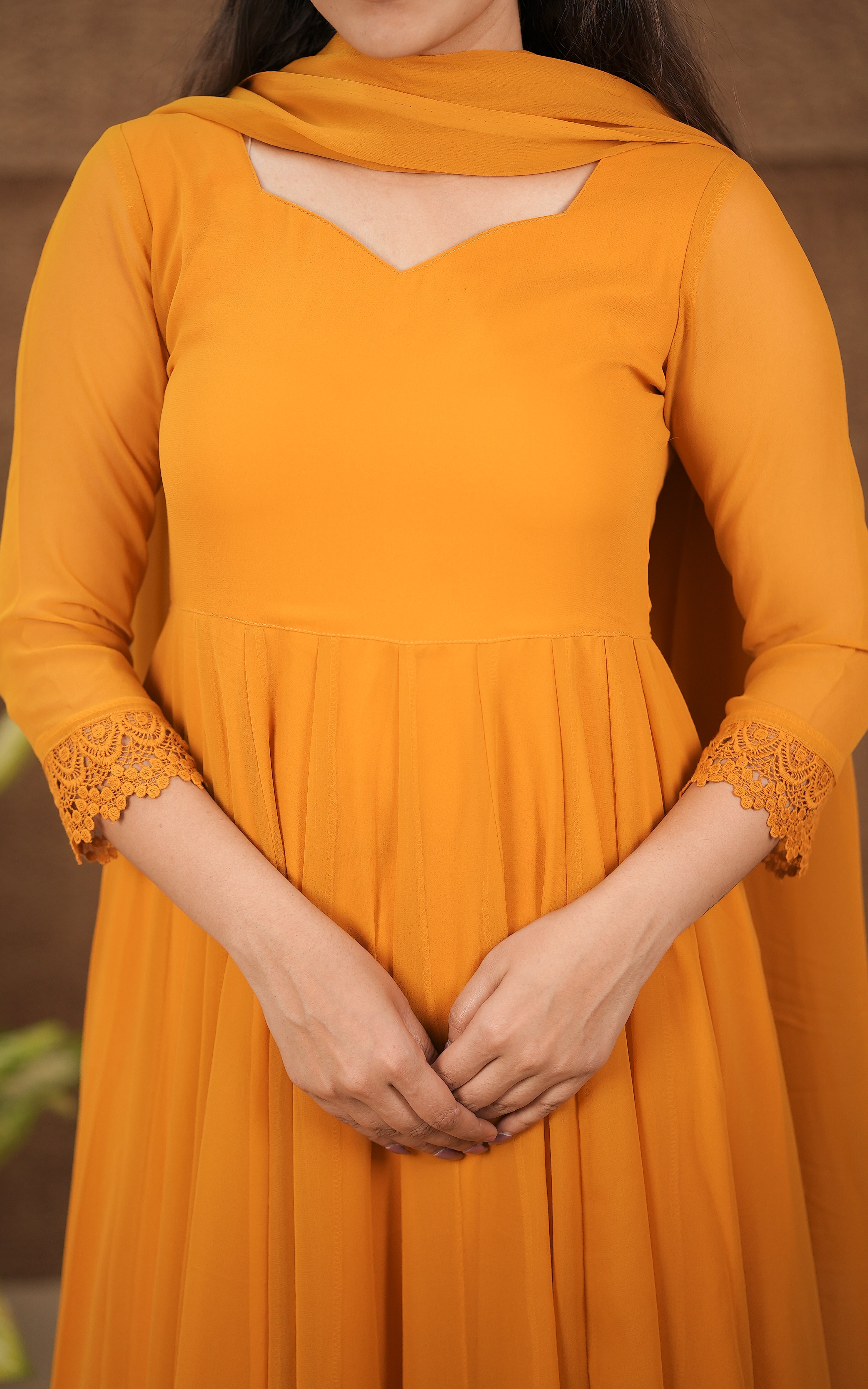 in store georgette with butter crepe lining full flared anarkali with crochet lace border color: mustard
