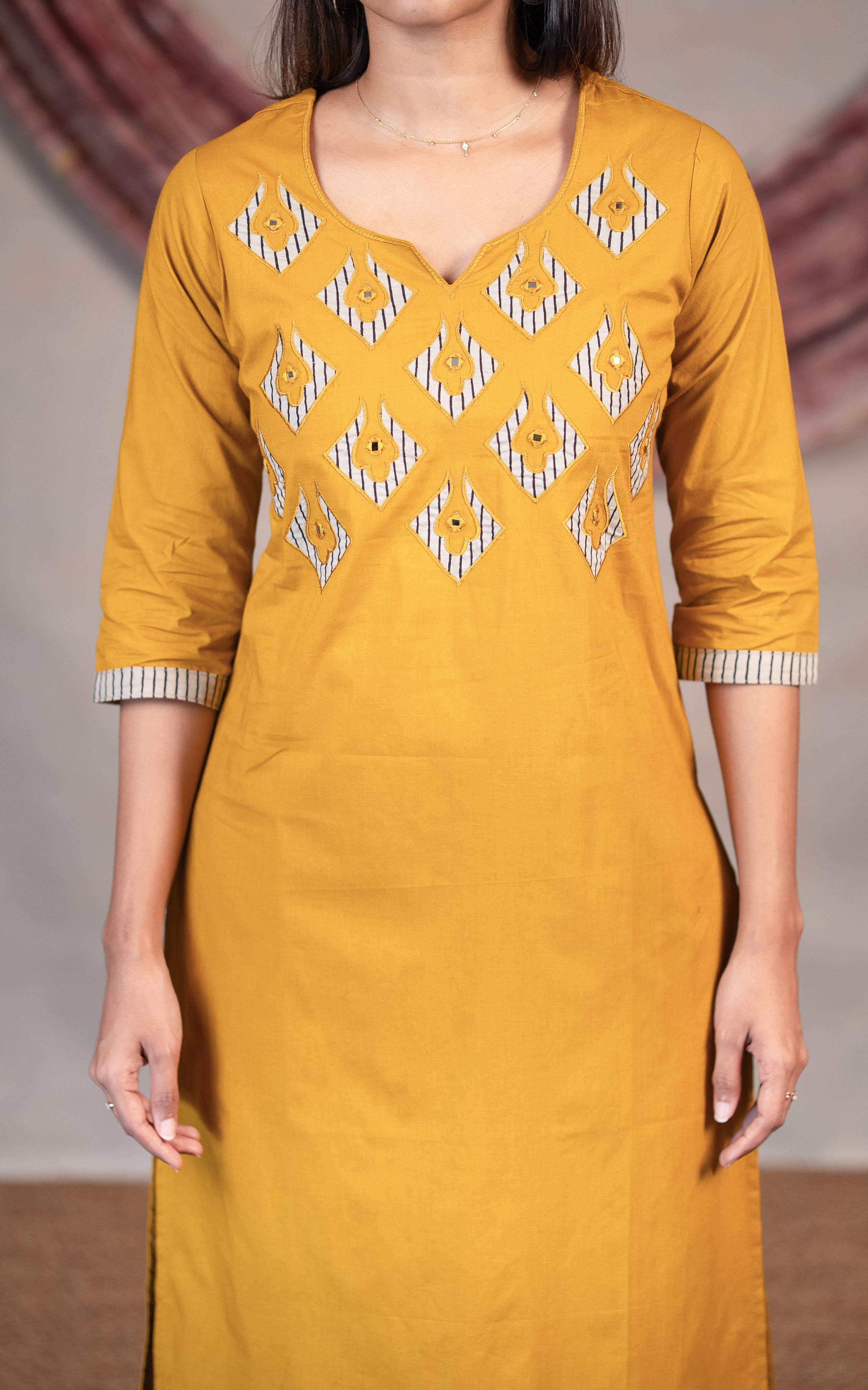 Mustard embroidered yoke cotton kurti for women