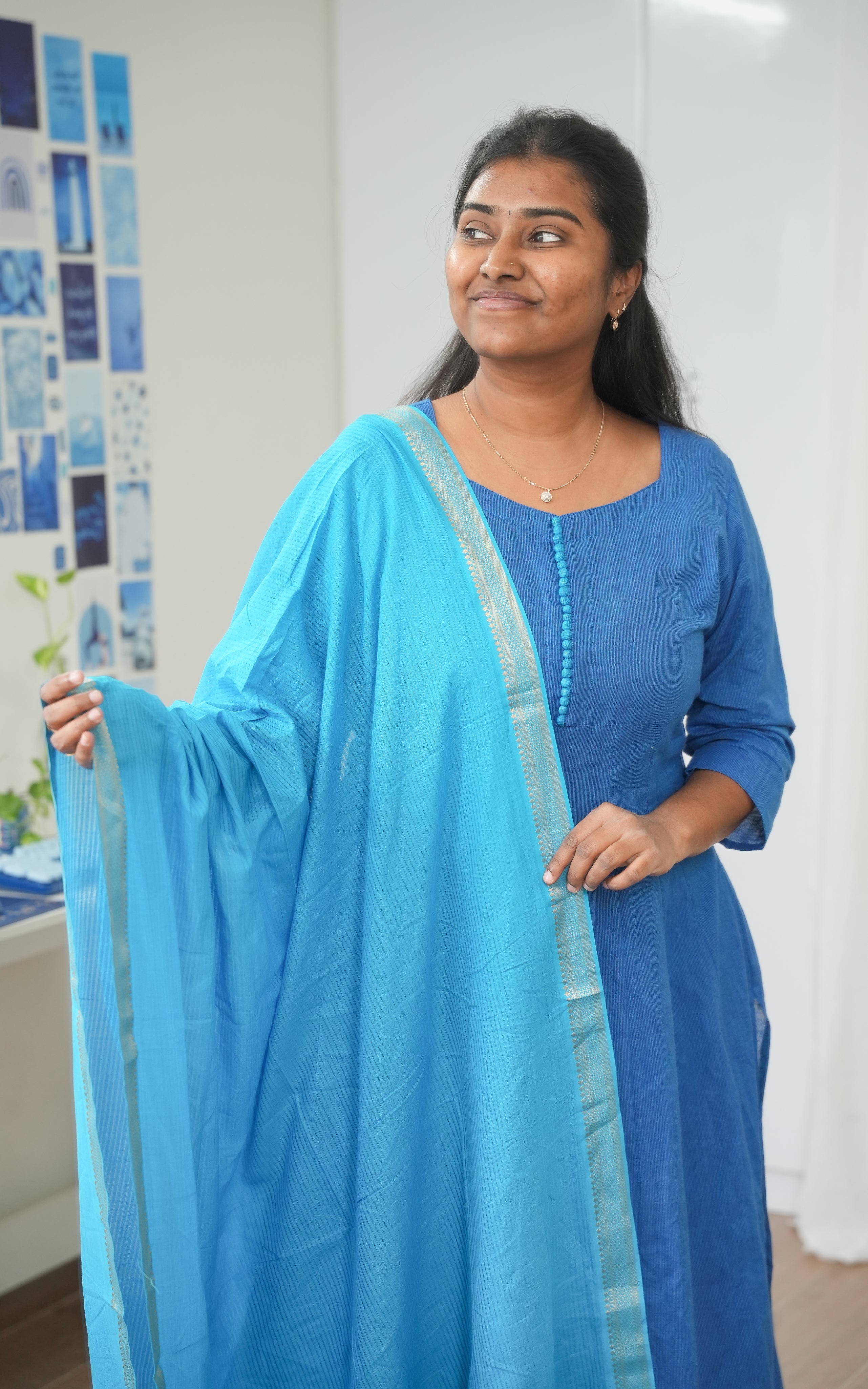 Sky blue and blue A-line kurti crafted from soft South Cotton, highlighting a feminine sweetheart neck design, round back closure, and charming potli button accents
