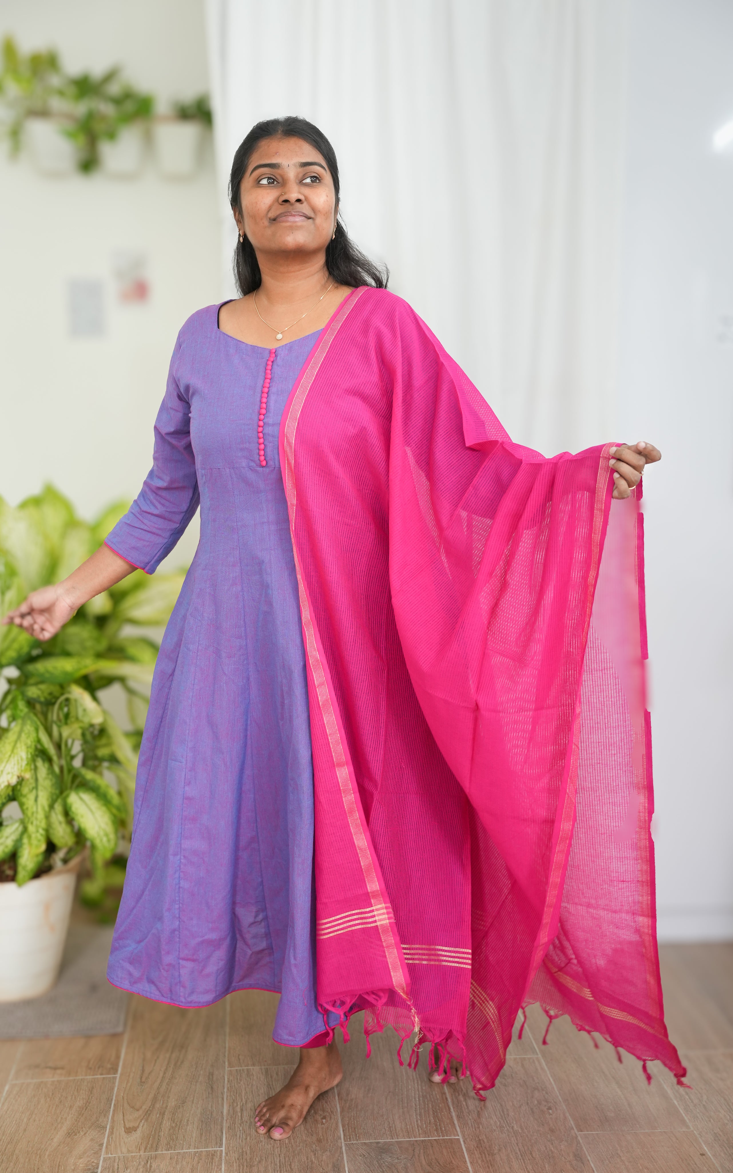 Purple South Cotton A-line kurti with side slit, paired with a pink dupatta featuring delicate border accents for a vibrant ethnic look