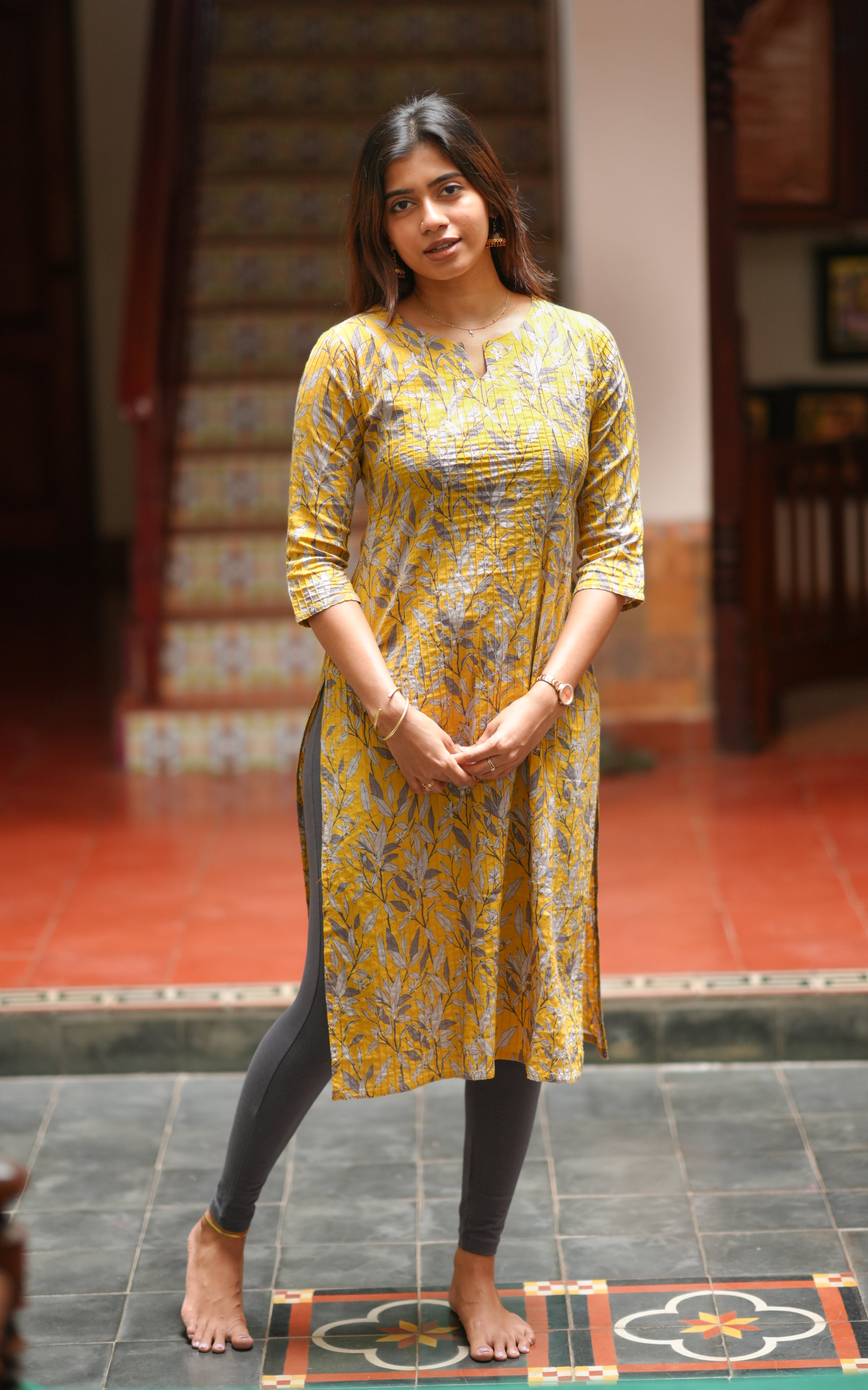 The kurti is crafted from soft cotton fabric and features fine pintuck detailing on the front.