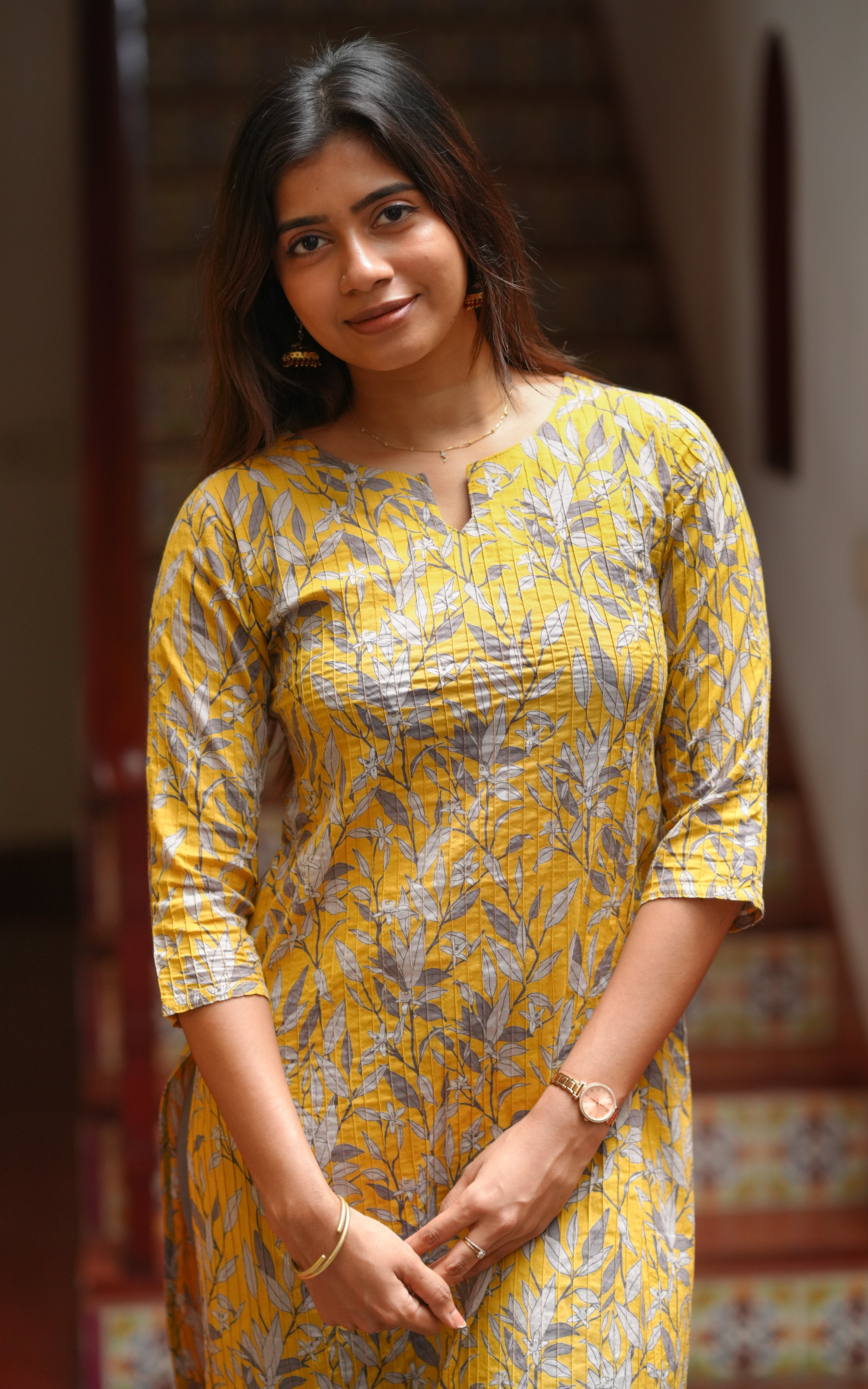 It has a simple notched neckline that adds a modern touch to the ethnic style.