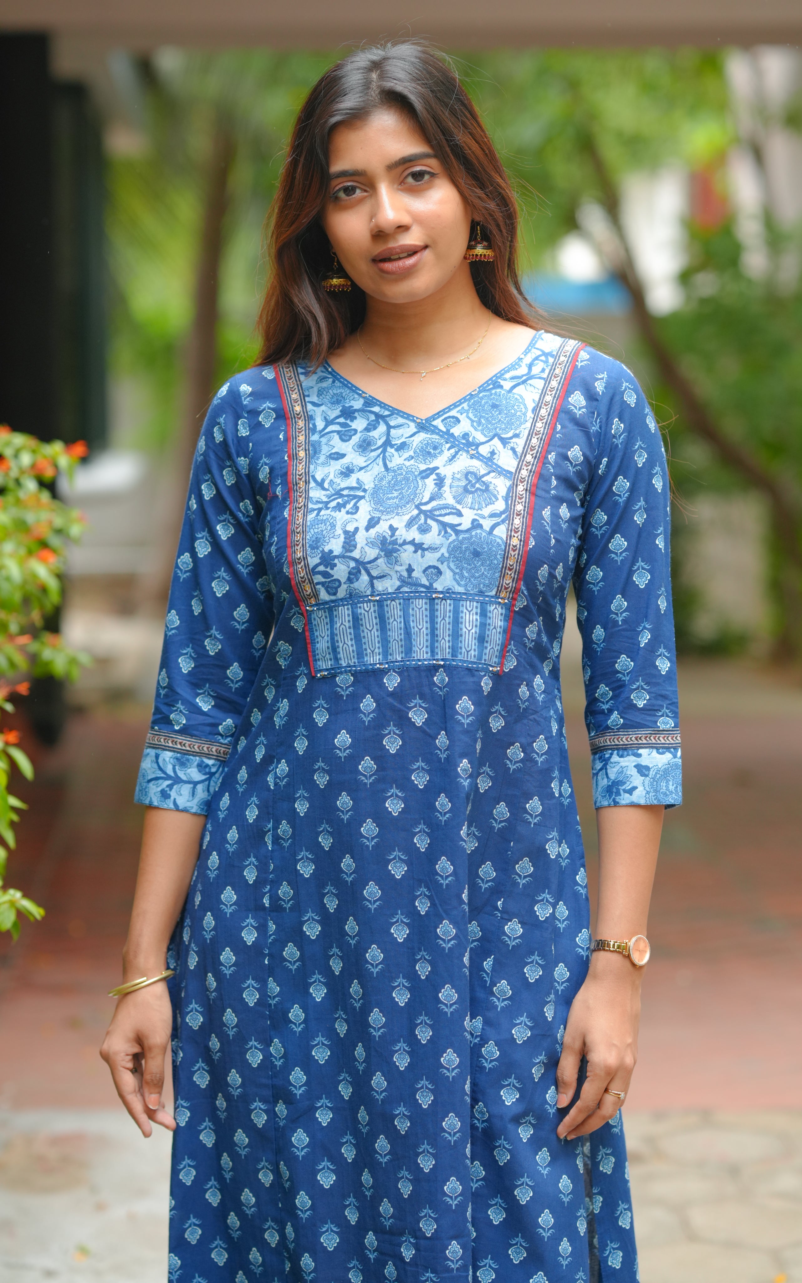The sleeve cuffs have a contrast print detail that complements the yoke design.