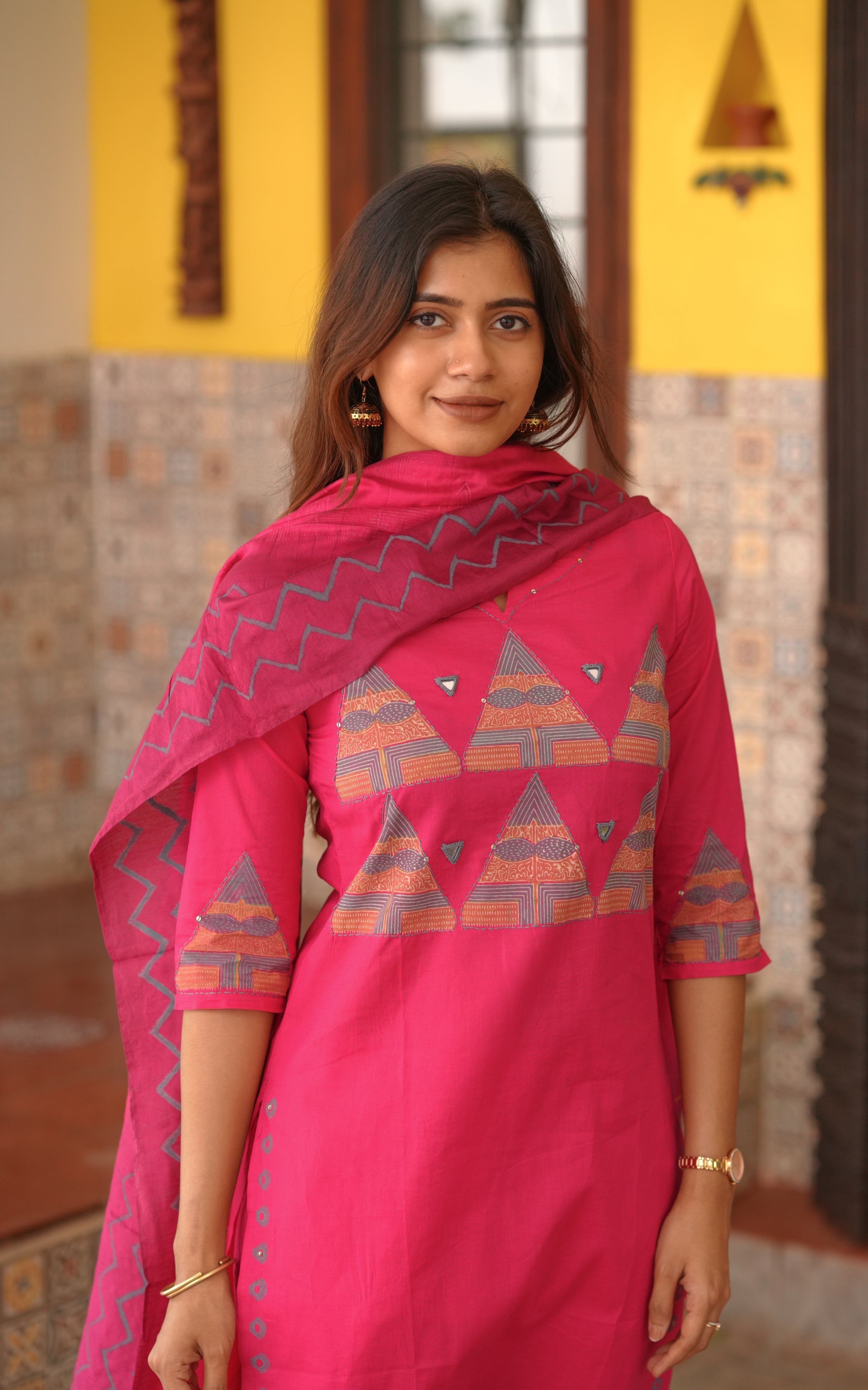 Straight cut pink kurti with triangle handblock motifs.