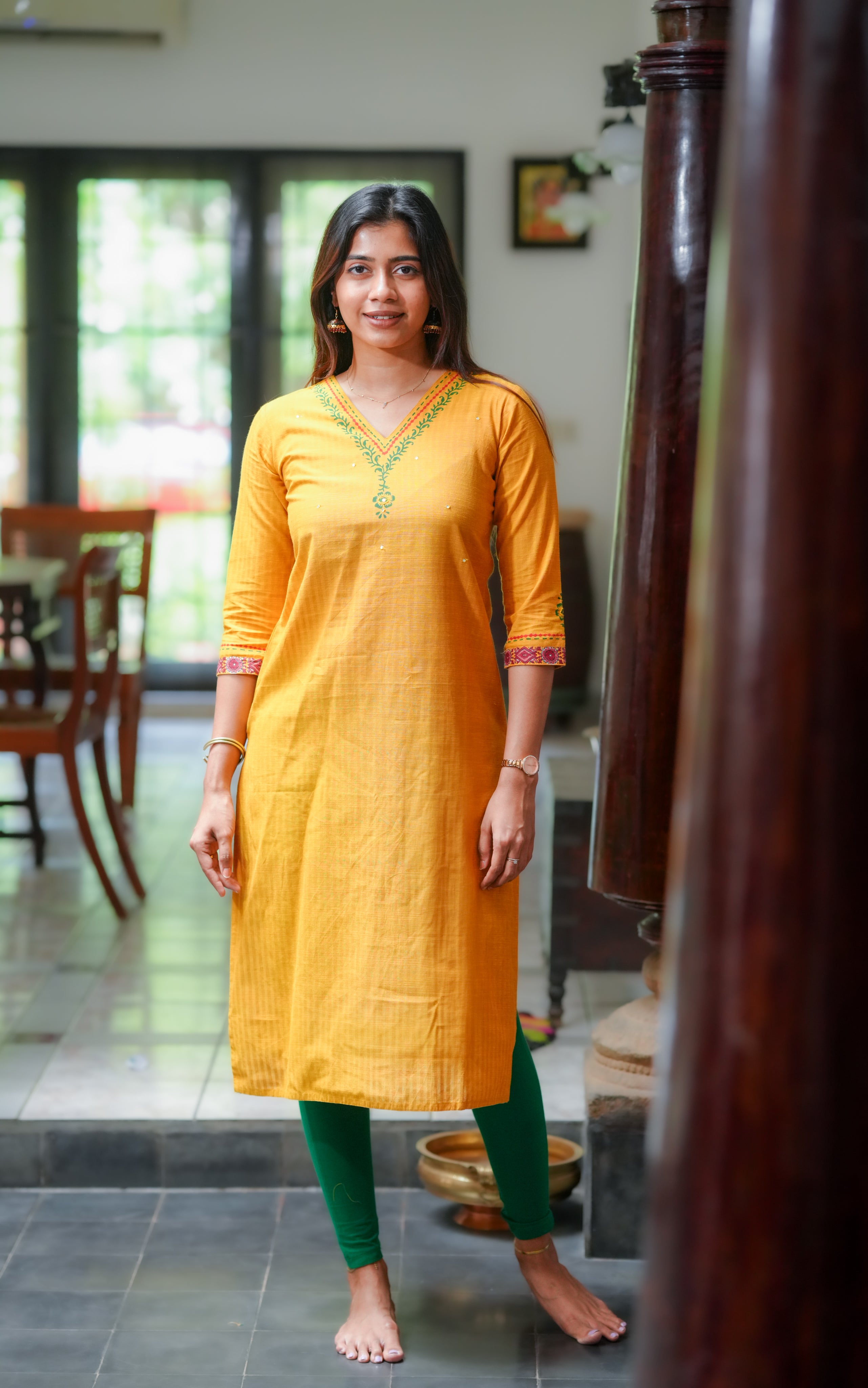 Features a straight cut kurti with side slits for a relaxed fit.