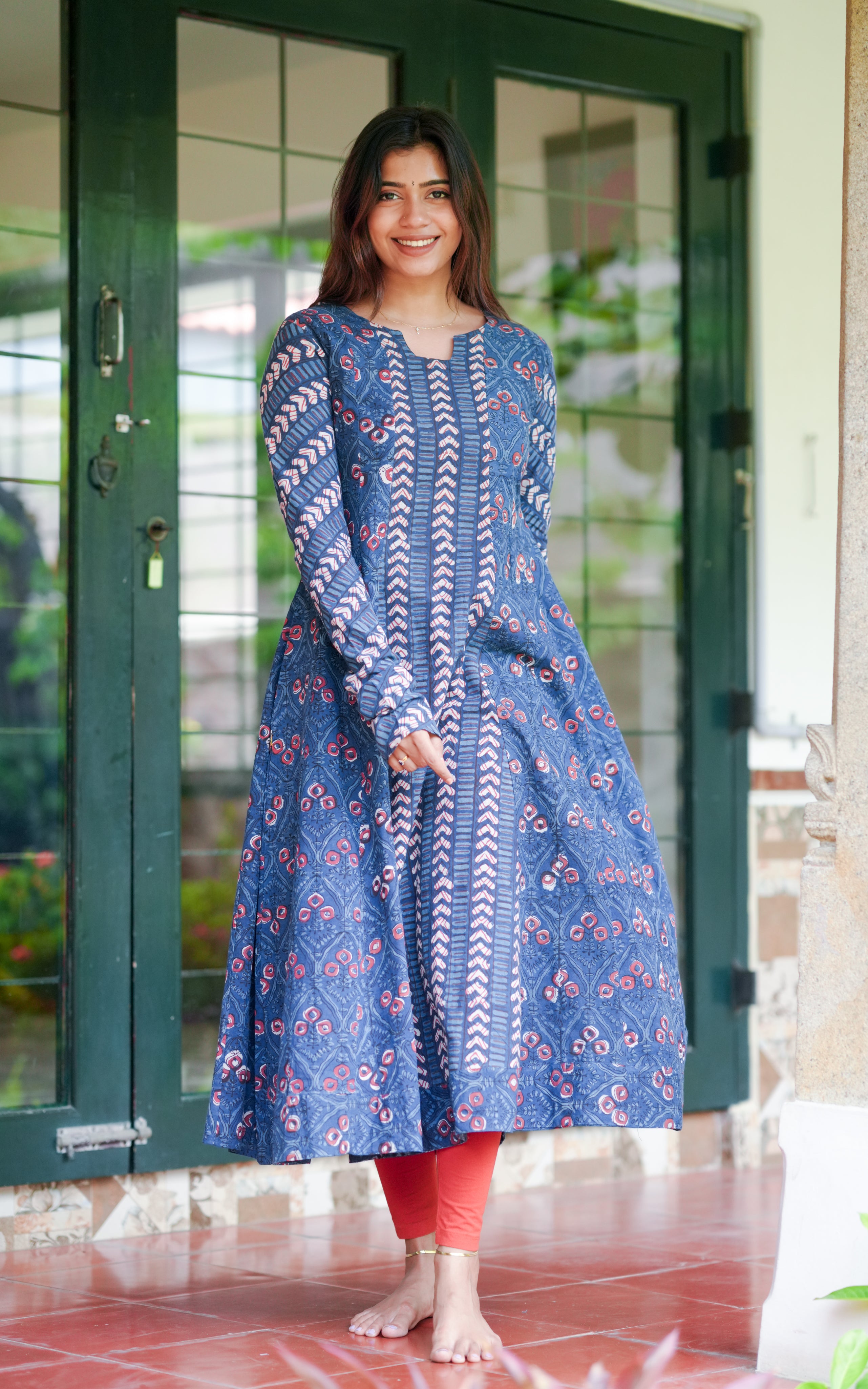 Woman wearing an indigo blue hand block printed Anarkali kurti