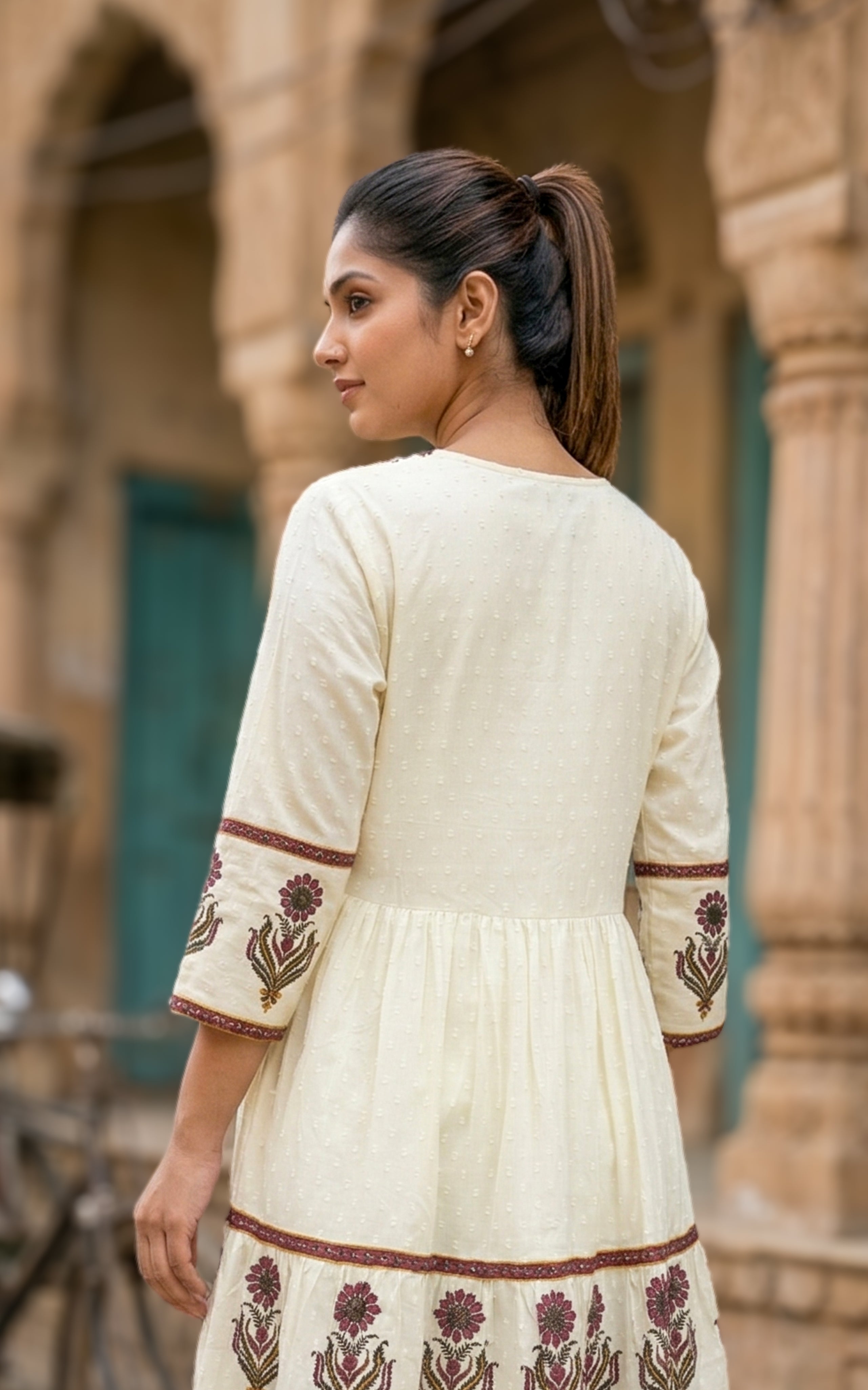 Back neckline features a modest round shape