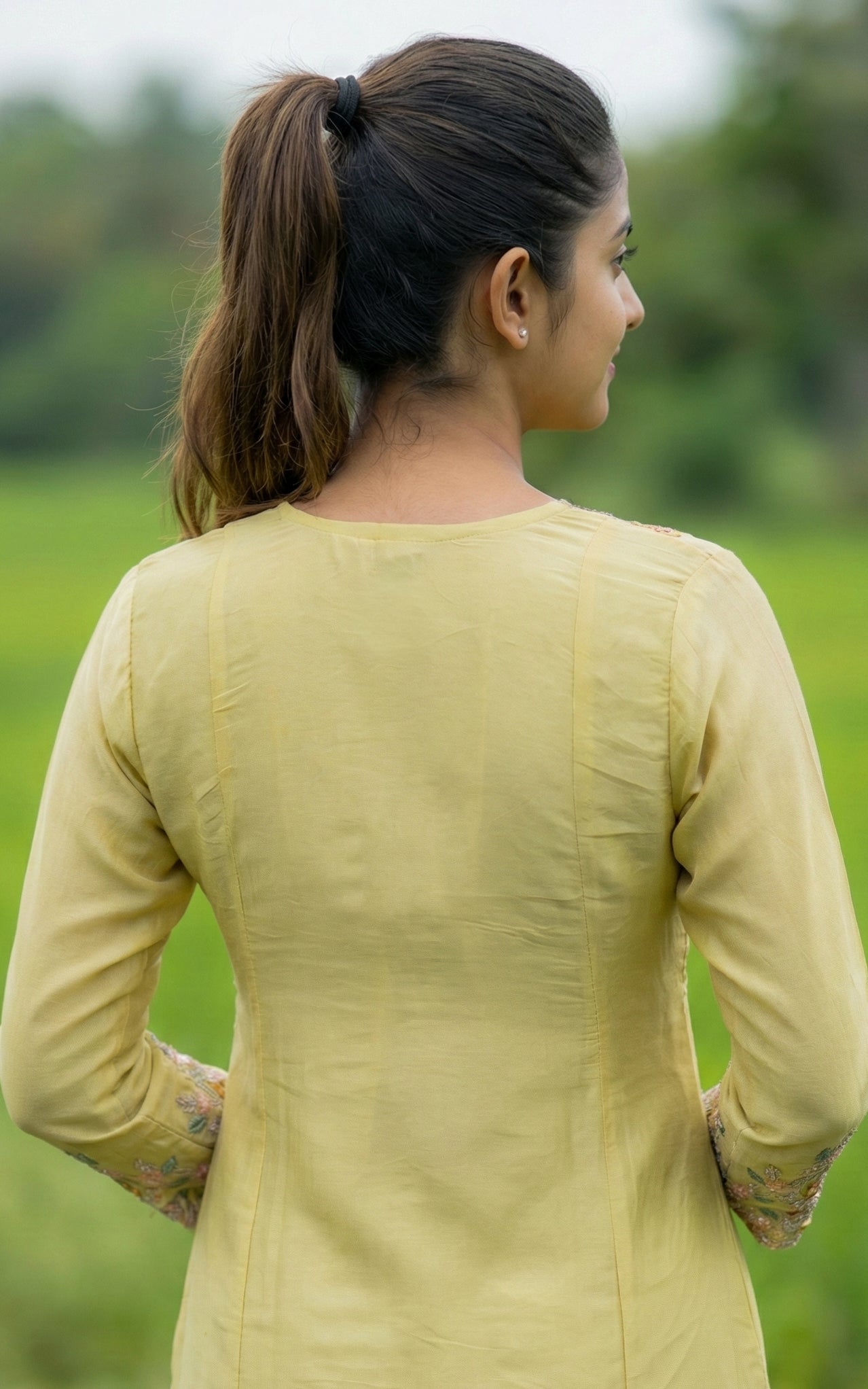 Woman wearing a light green kurti