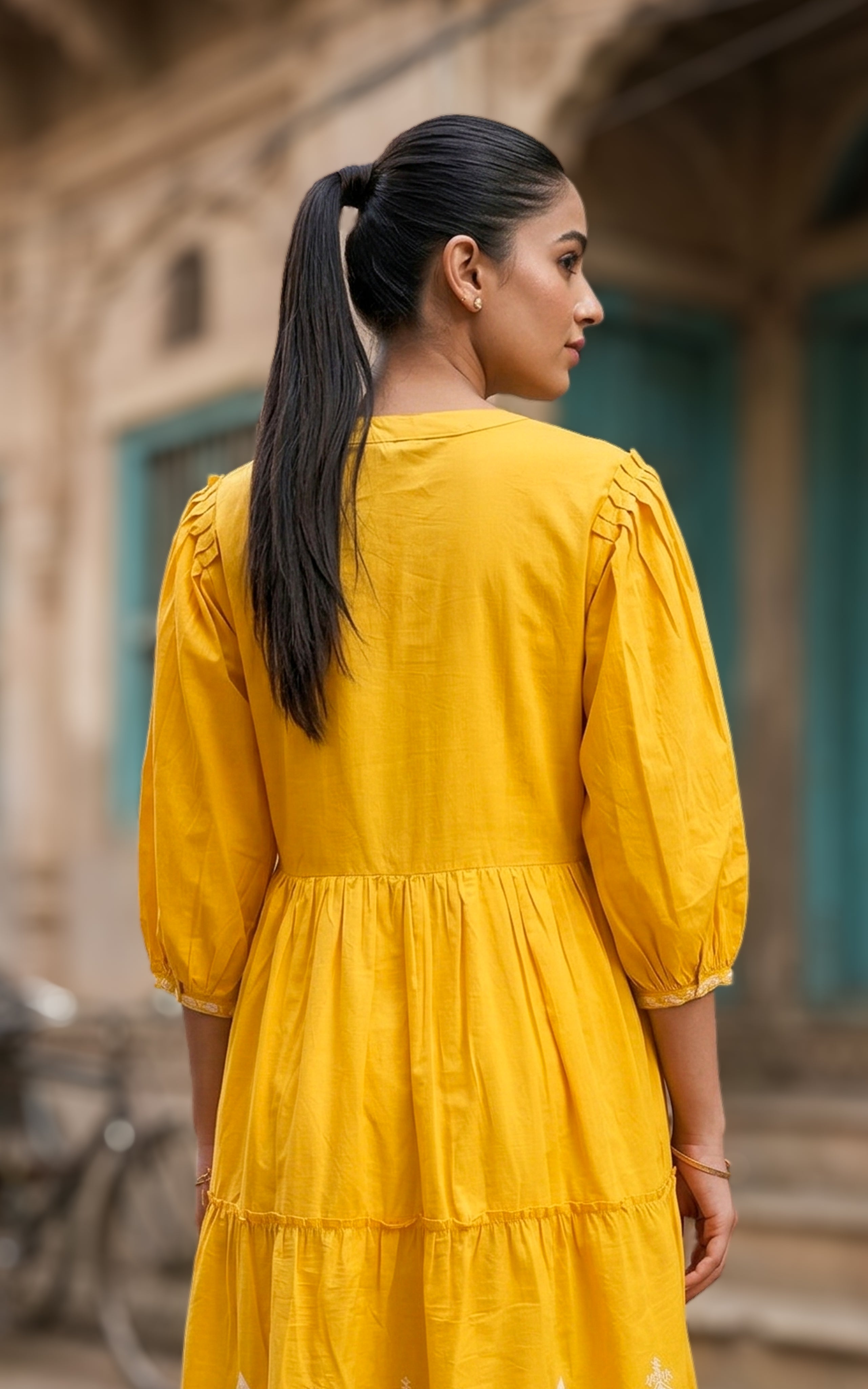 Back neckline features a modest round shape