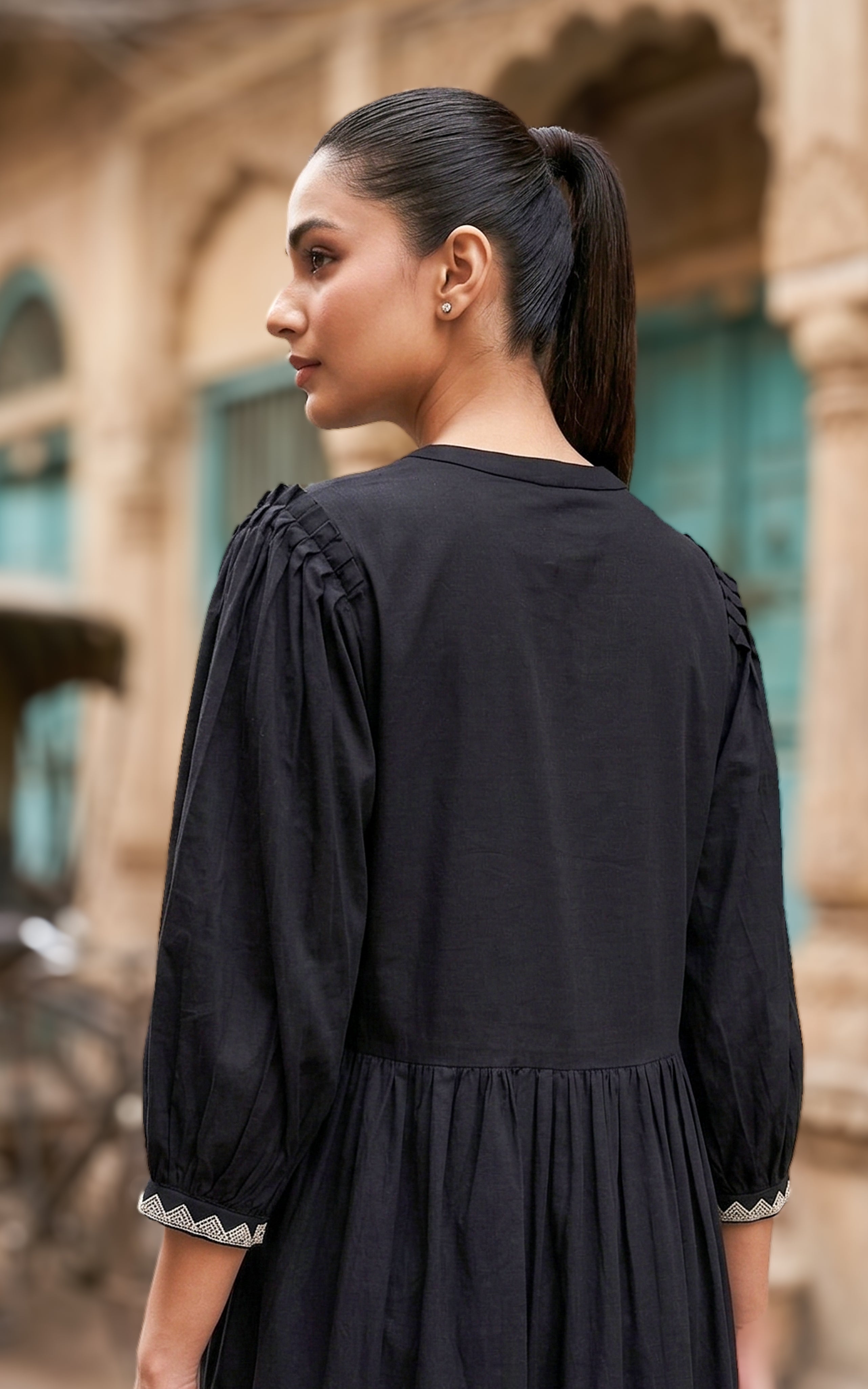 Back Neckline Features a Modest Round Shape