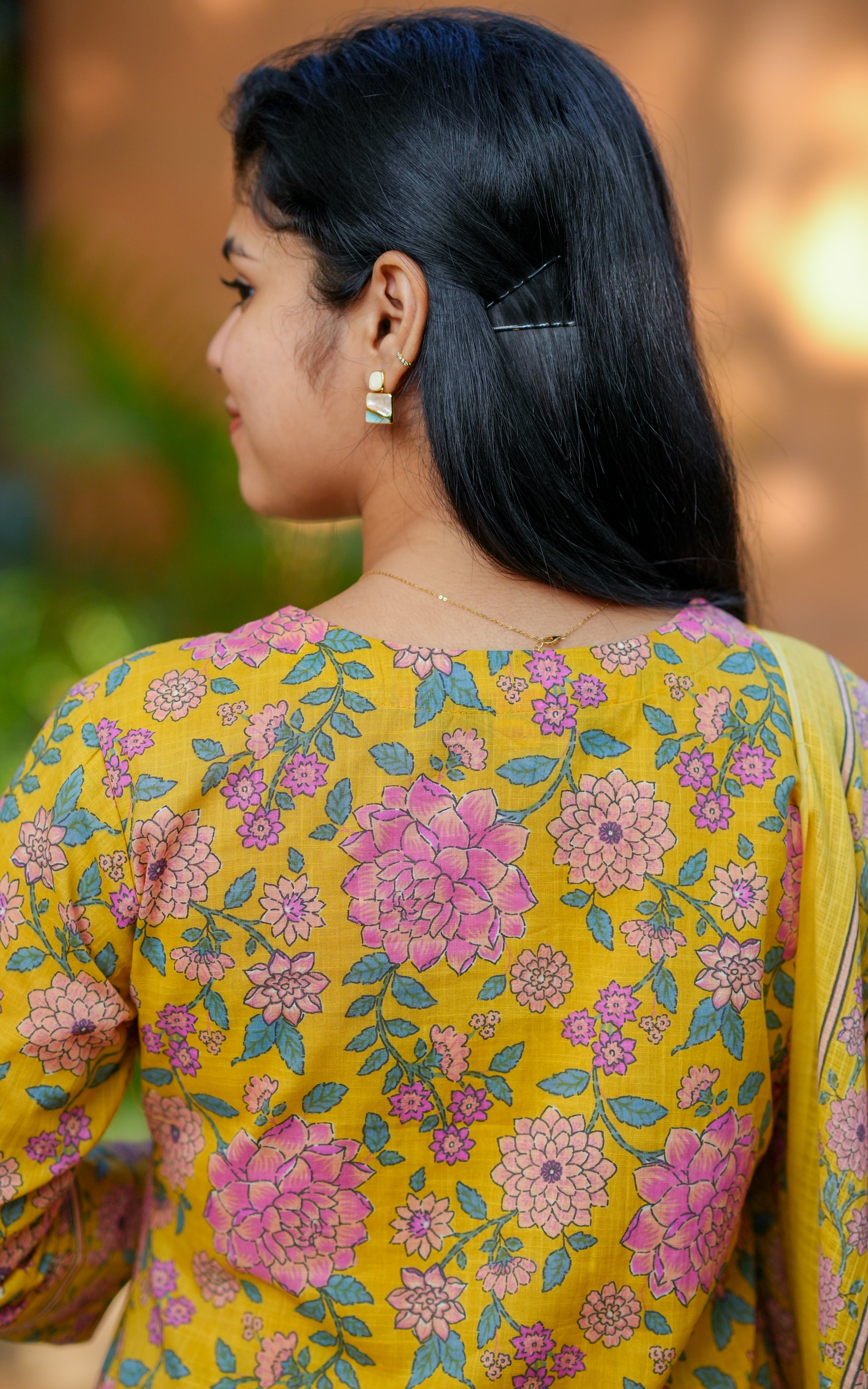 Woman wearing a yellow floral kurti
