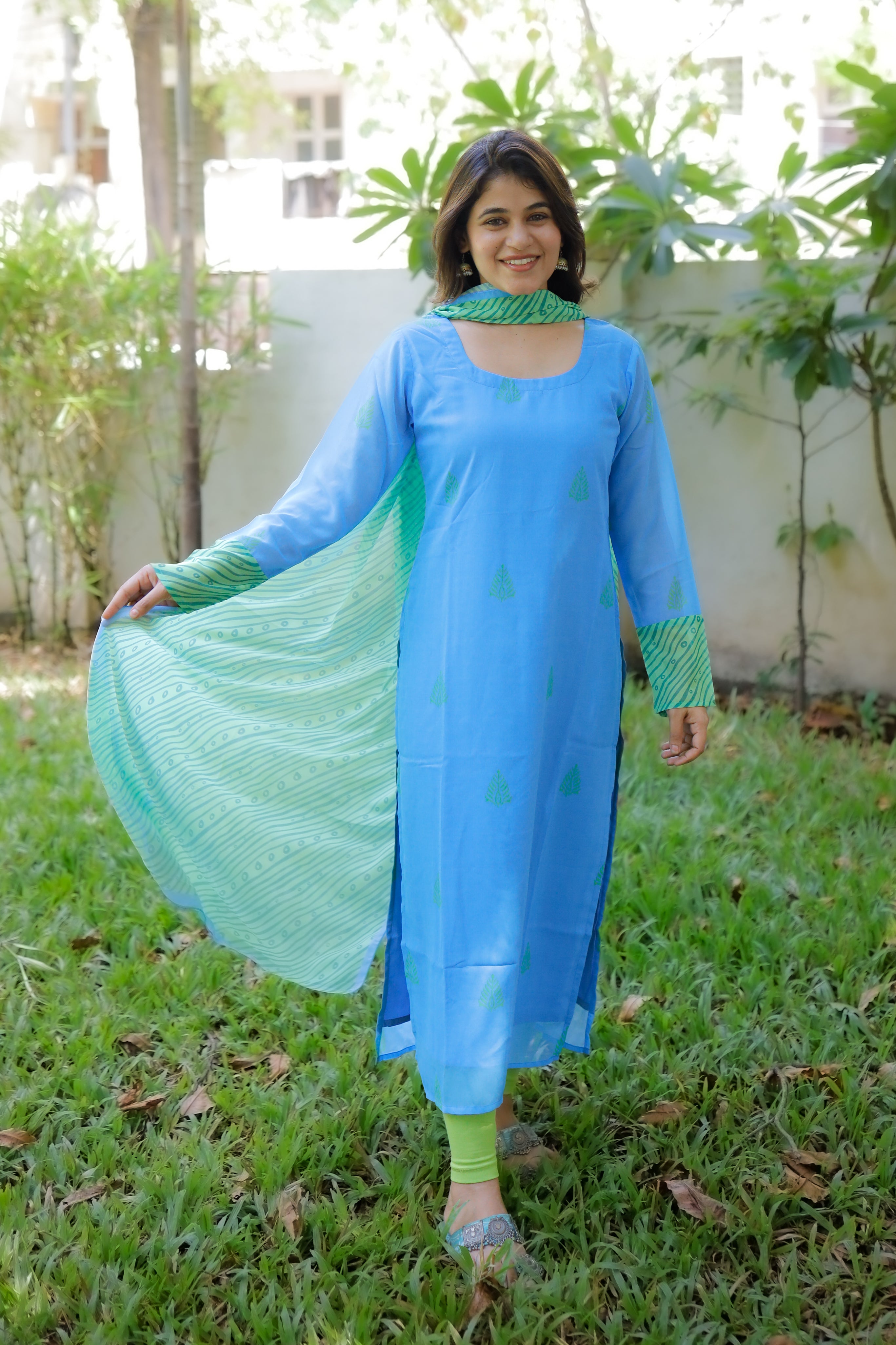 Dupatta is georgette, in blue with green patterns